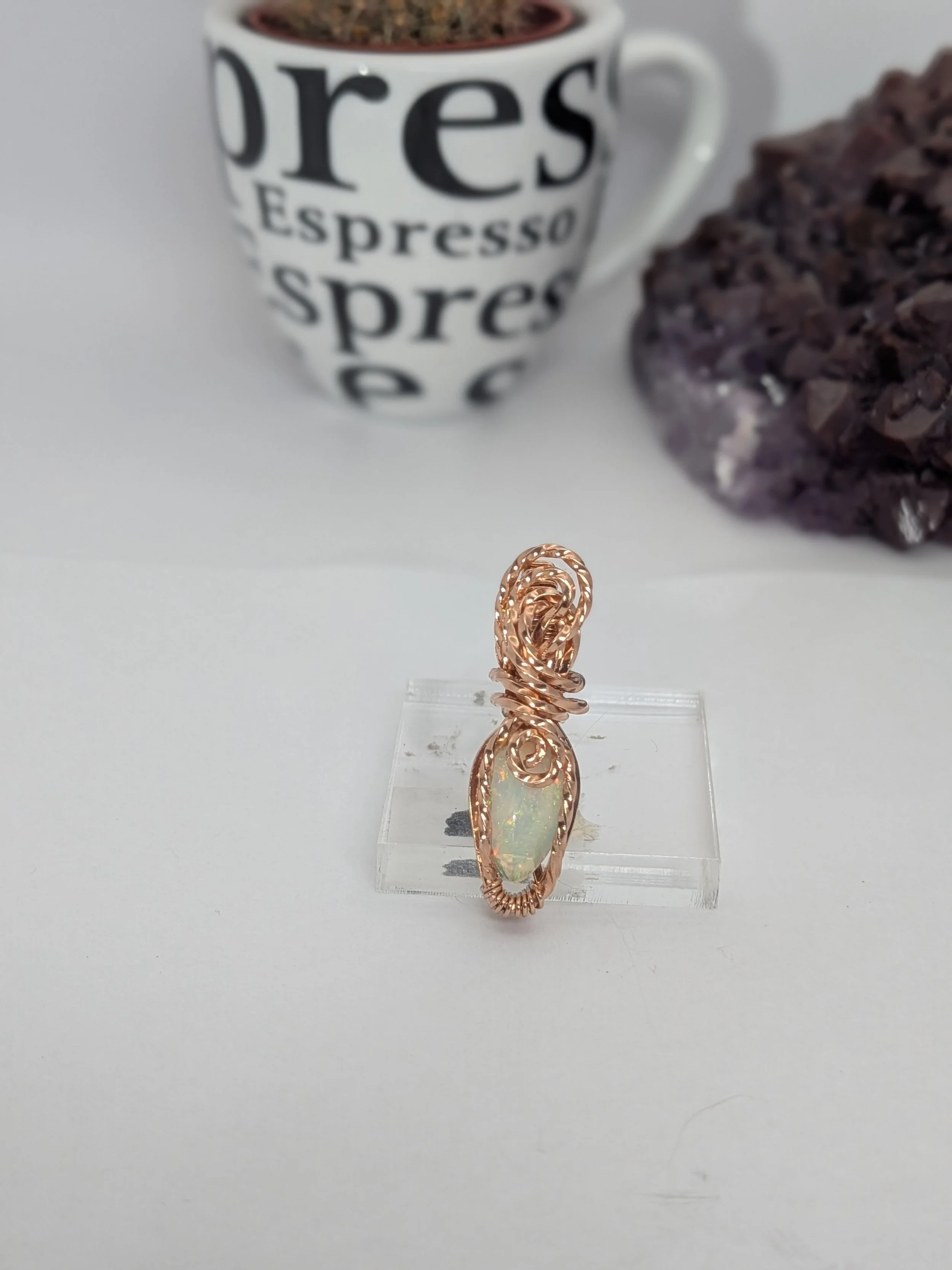 Gorgeous petite gemstone pendant, intricately wire-wrapped and accented with a heart-style bail, beautifully highlighting the stone as the centrepiece.