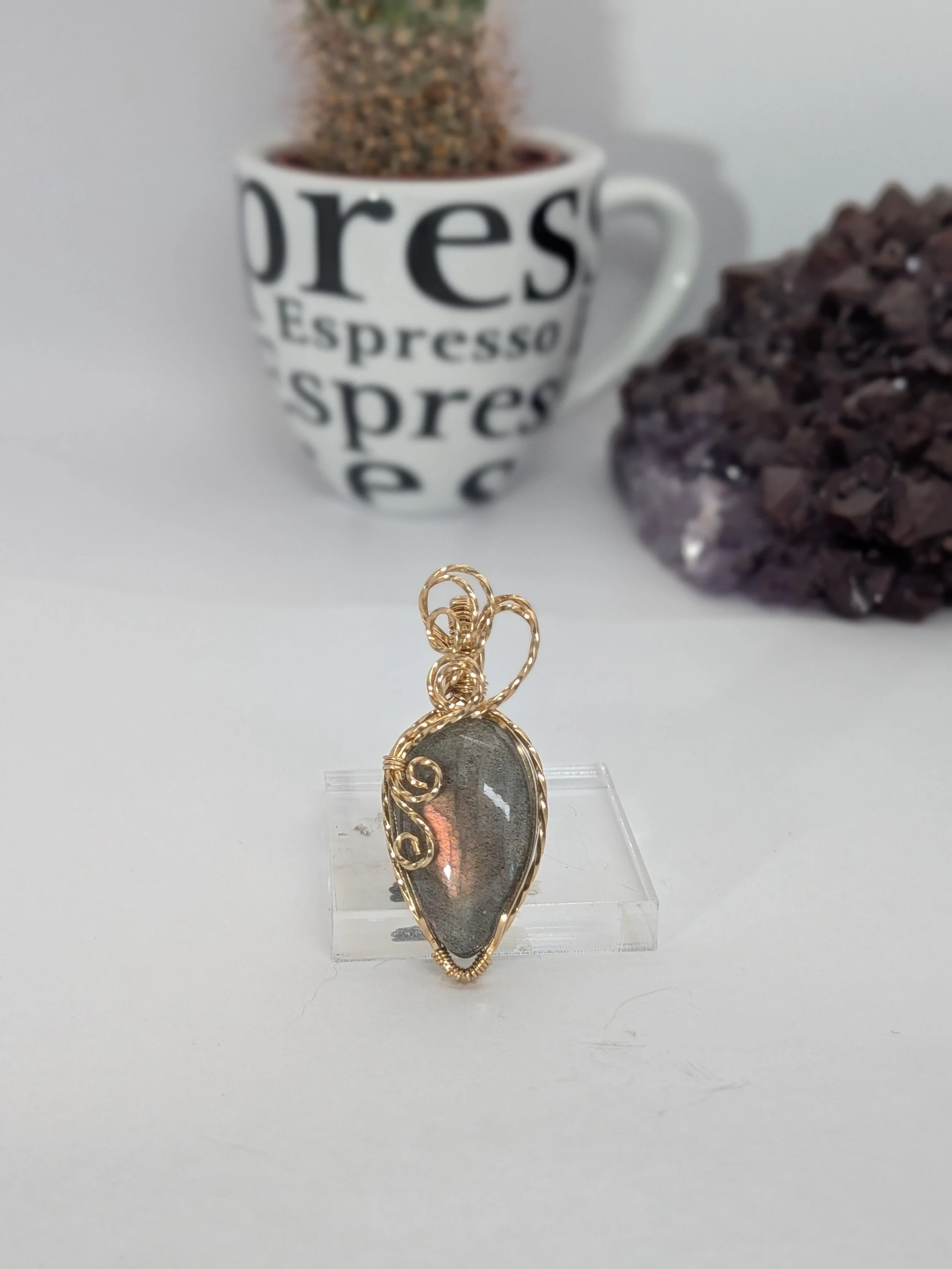 Gorgeous petite labradorite pendant, intricately wire-wrapped and accented with a heart-style bail, beautifully highlighting the stone as the centrepiece.