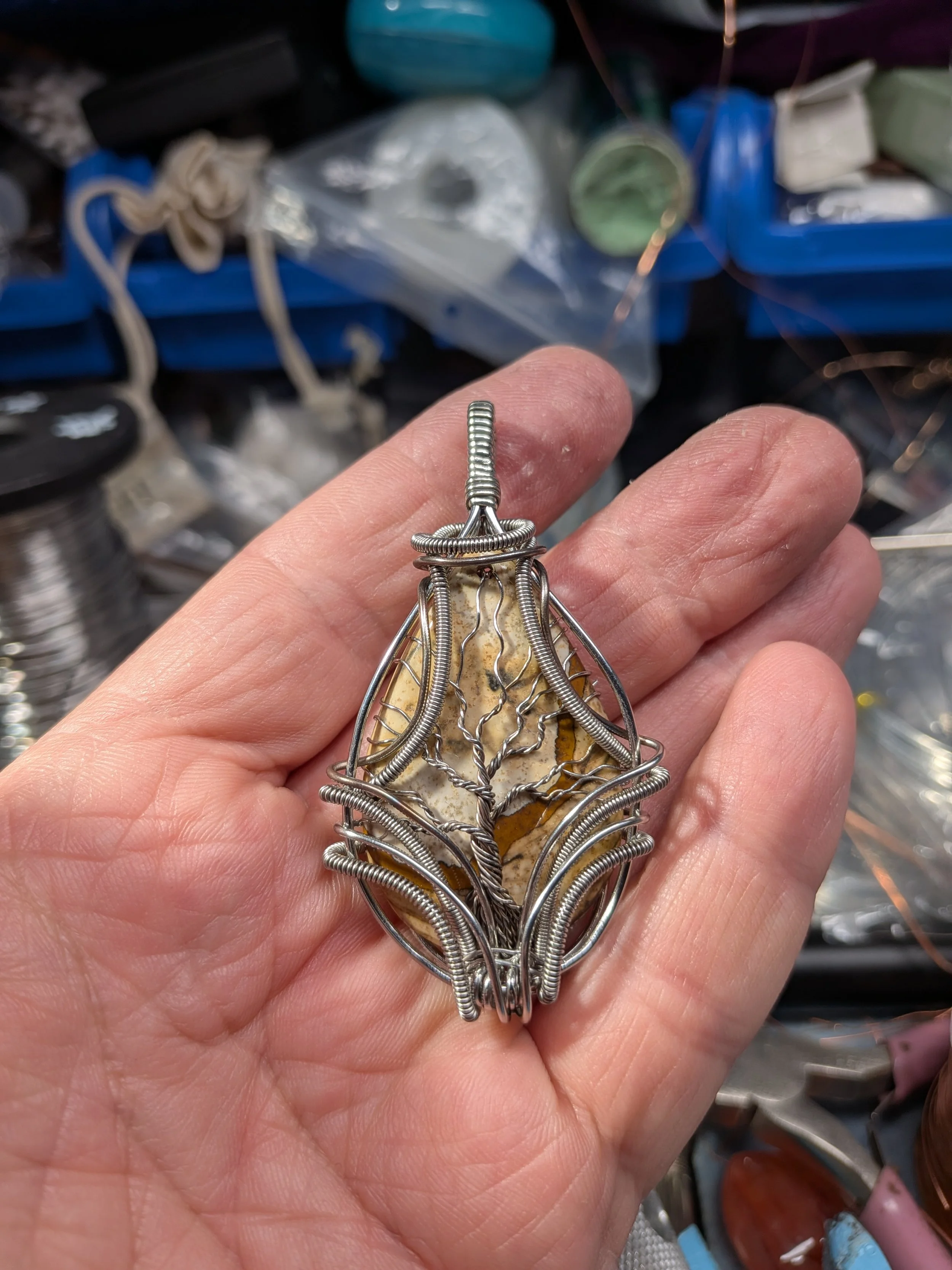 This captivating, stainless wire Picture Jasper tree of life pendant draws you into a stunning forest. Featuring a clean background, this piece offers a beautiful, detailed view on both sides.