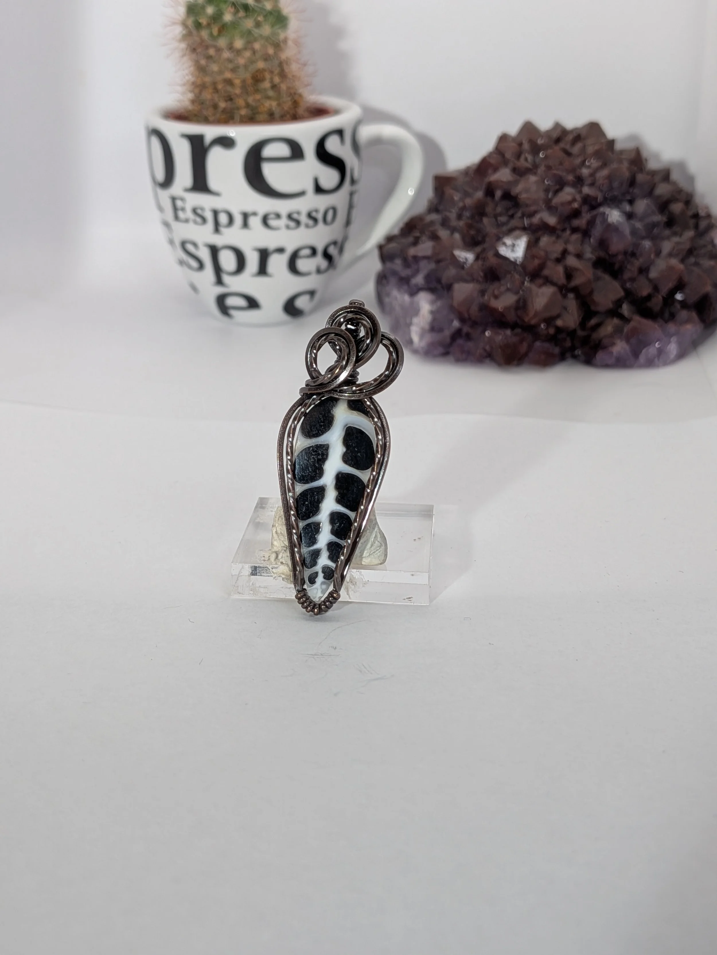 Gorgeous petite gemstone pendant, intricately wire-wrapped and accented with a heart-style bail, beautifully highlighting the stone as the centrepiece.