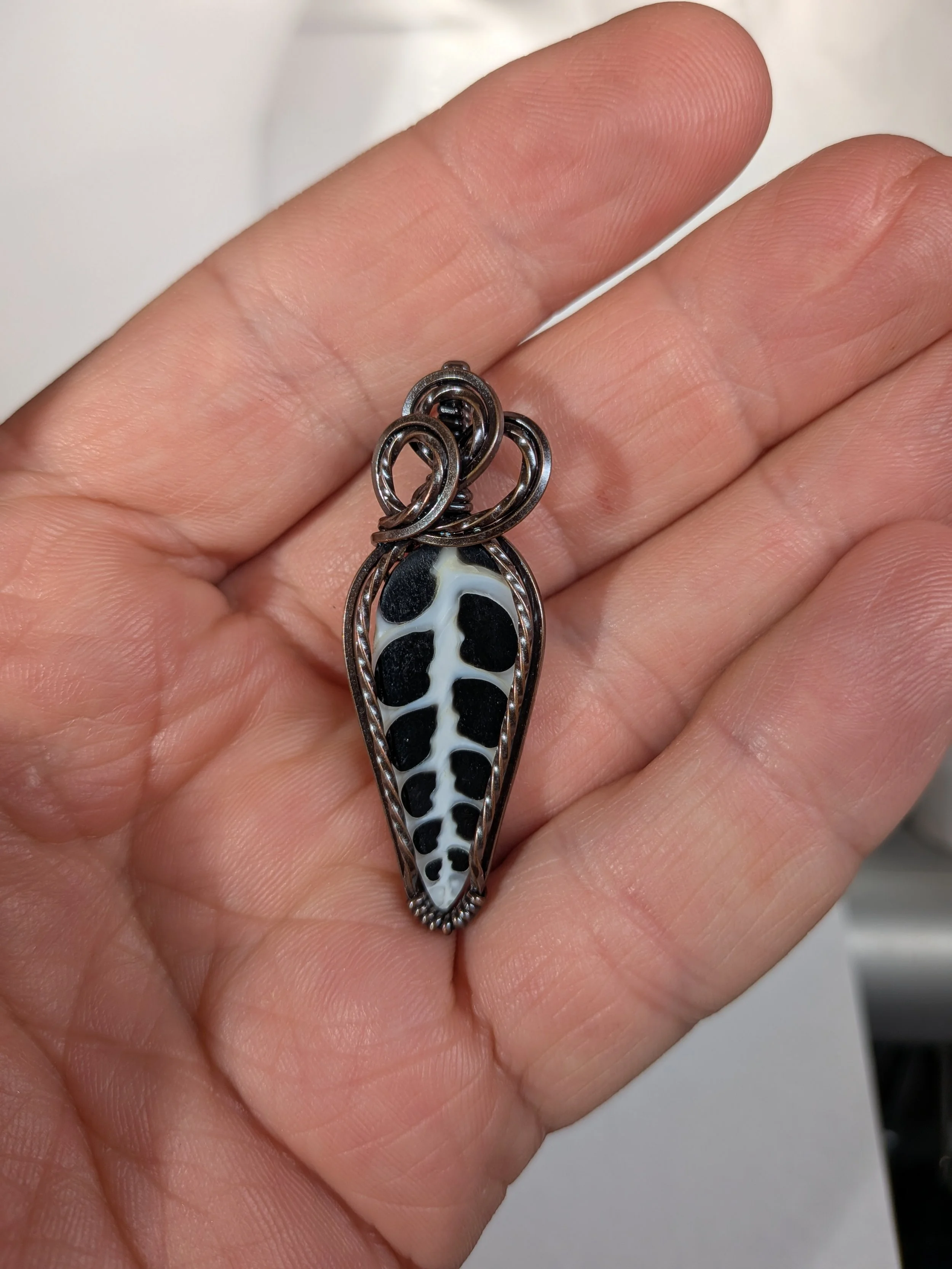 Gorgeous petite gemstone pendant, intricately wire-wrapped and accented with a heart-style bail, beautifully highlighting the stone as the centrepiece.