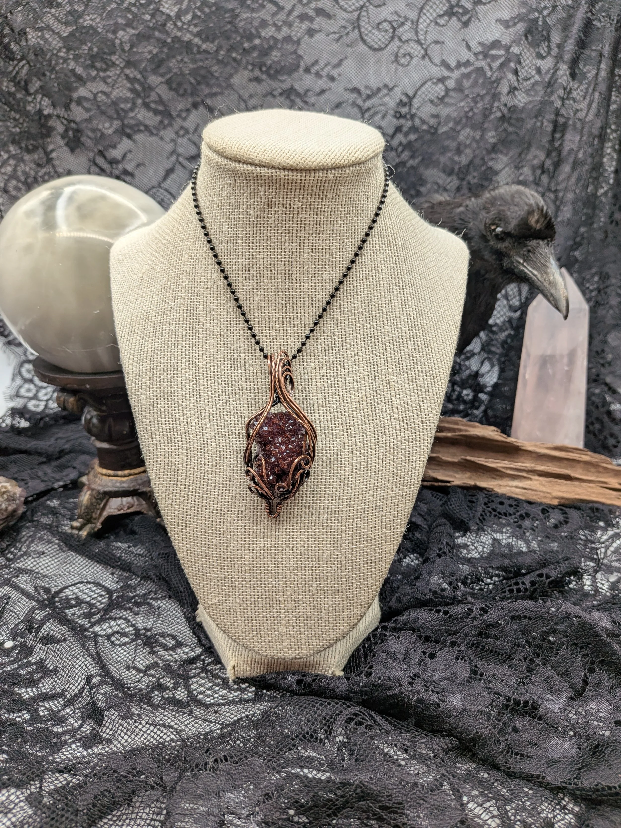A stunning Thunder Bay amethyst cluster wrapped in Viking copper wire, elegantly accented with wavy copper to highlight the amethyst as the focal point.jpg