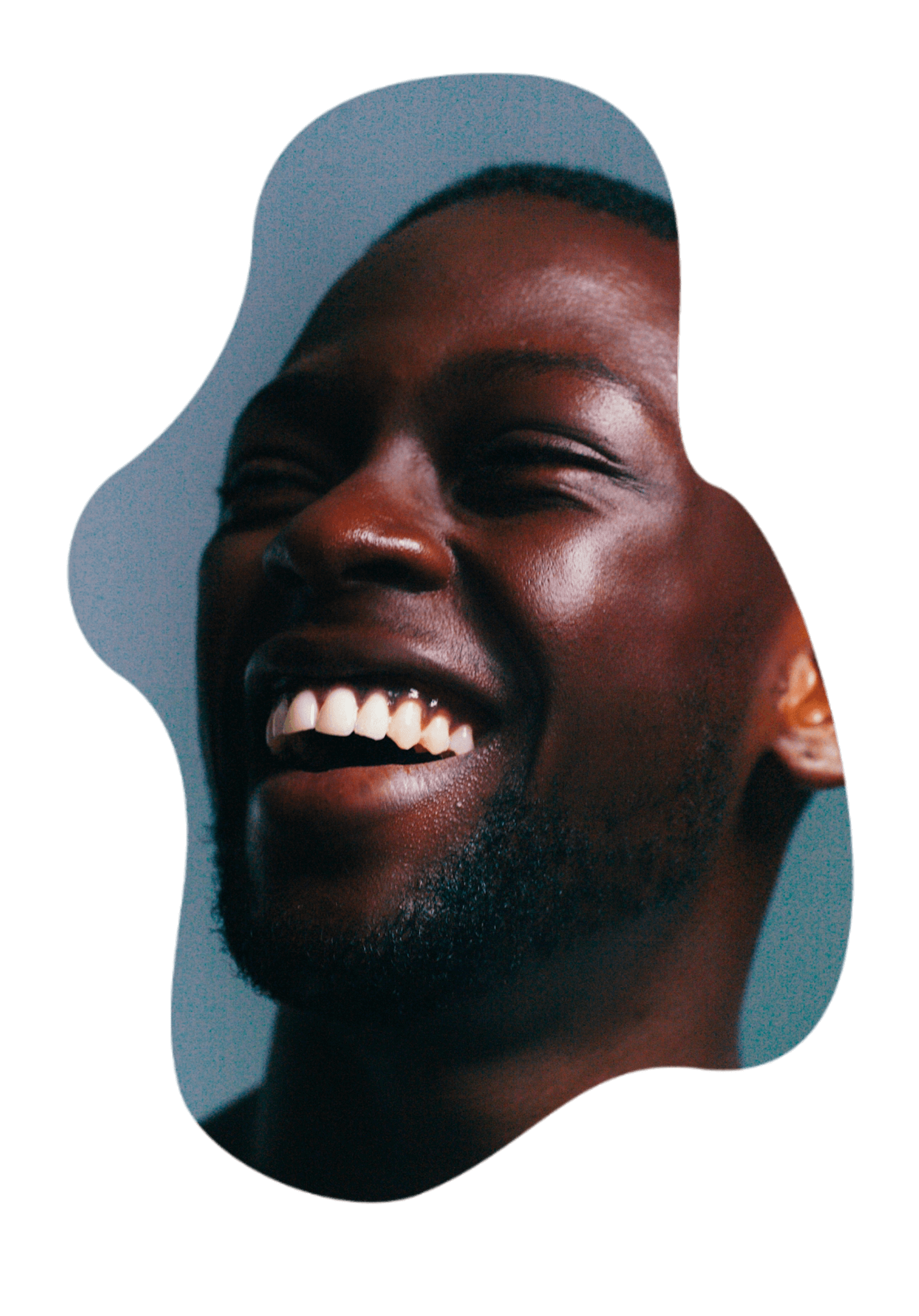 A smiling man with clear, radiant skin.