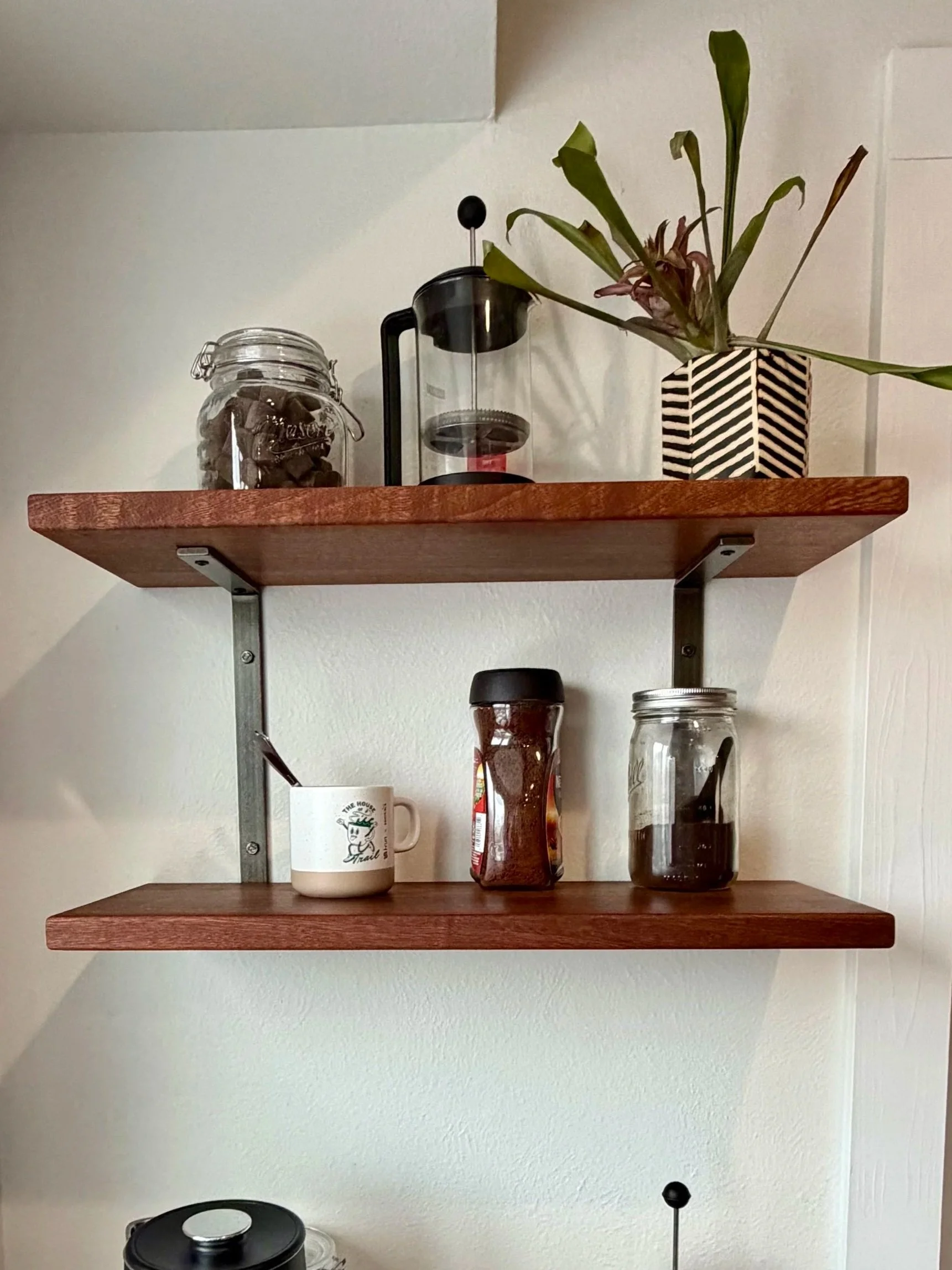 Sapele shelves on clear coated raw steel brackets 