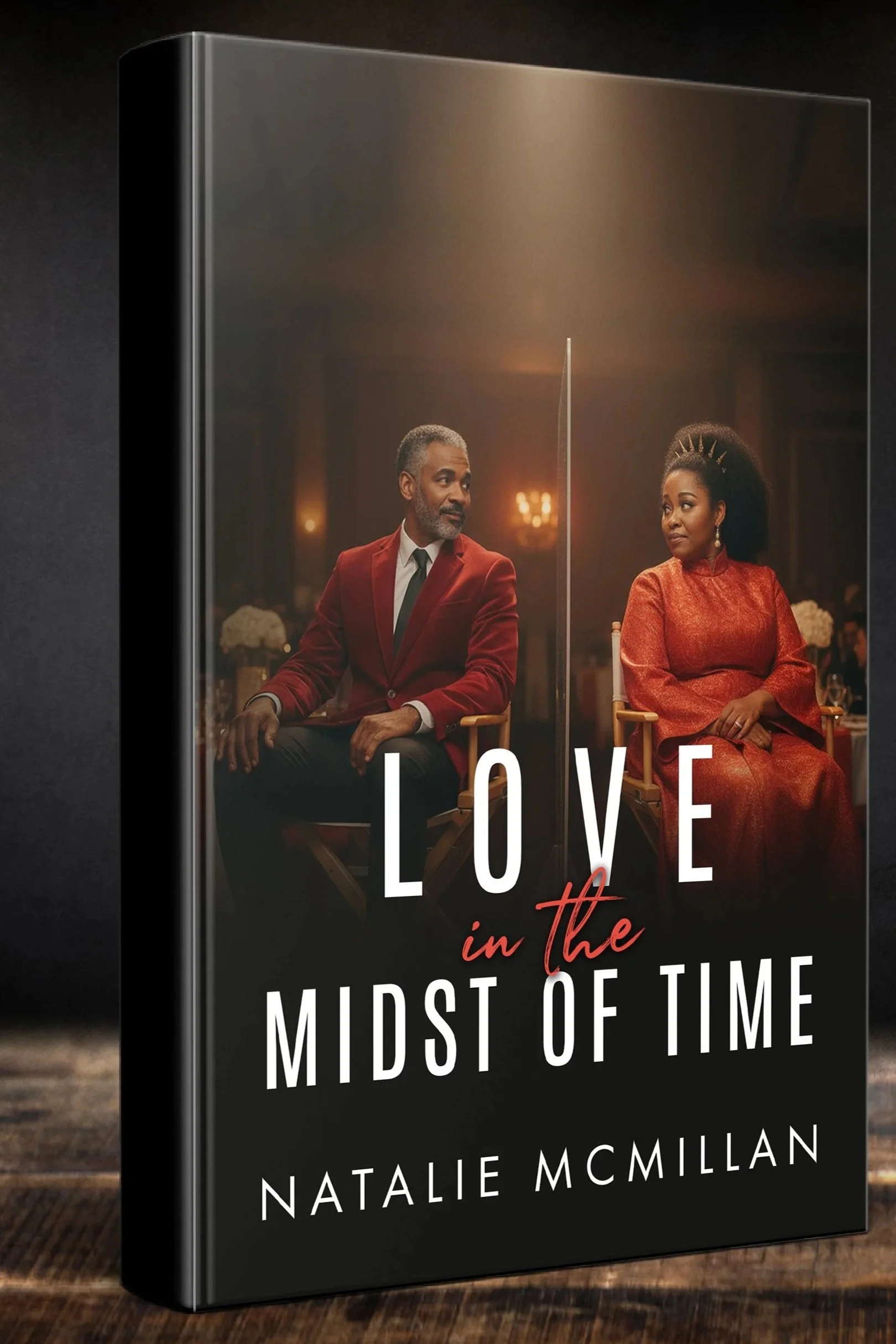 Book cover for "Love in the Midst of Time" by Natalie McMillan, featuring a mature African American man and woman seated apart, separated by a transparent glass panel, in a dimly lit, elegant setting.