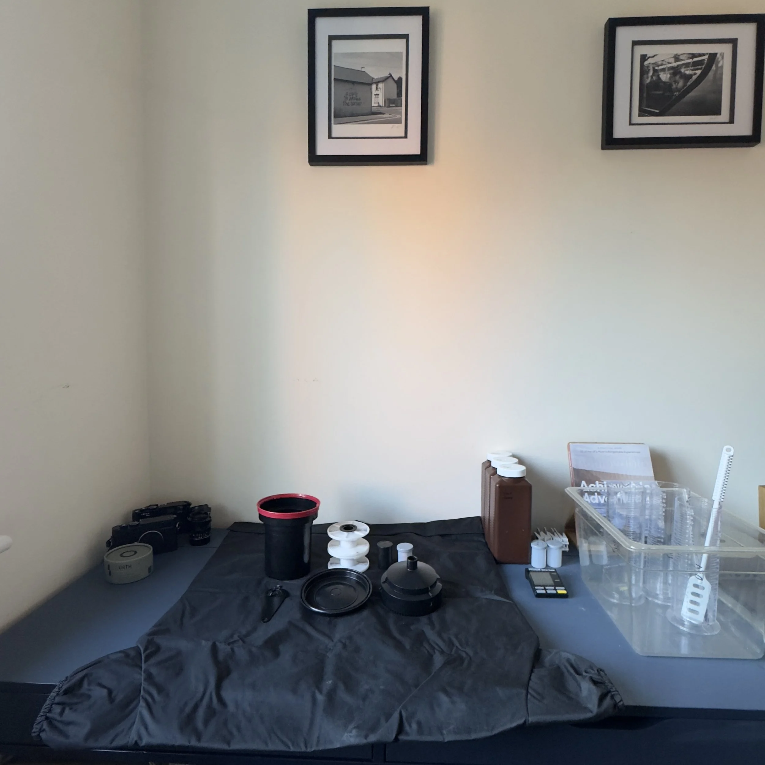 35mm film loaded onto a developing reel inside a darkroom tank, ready for home film processing