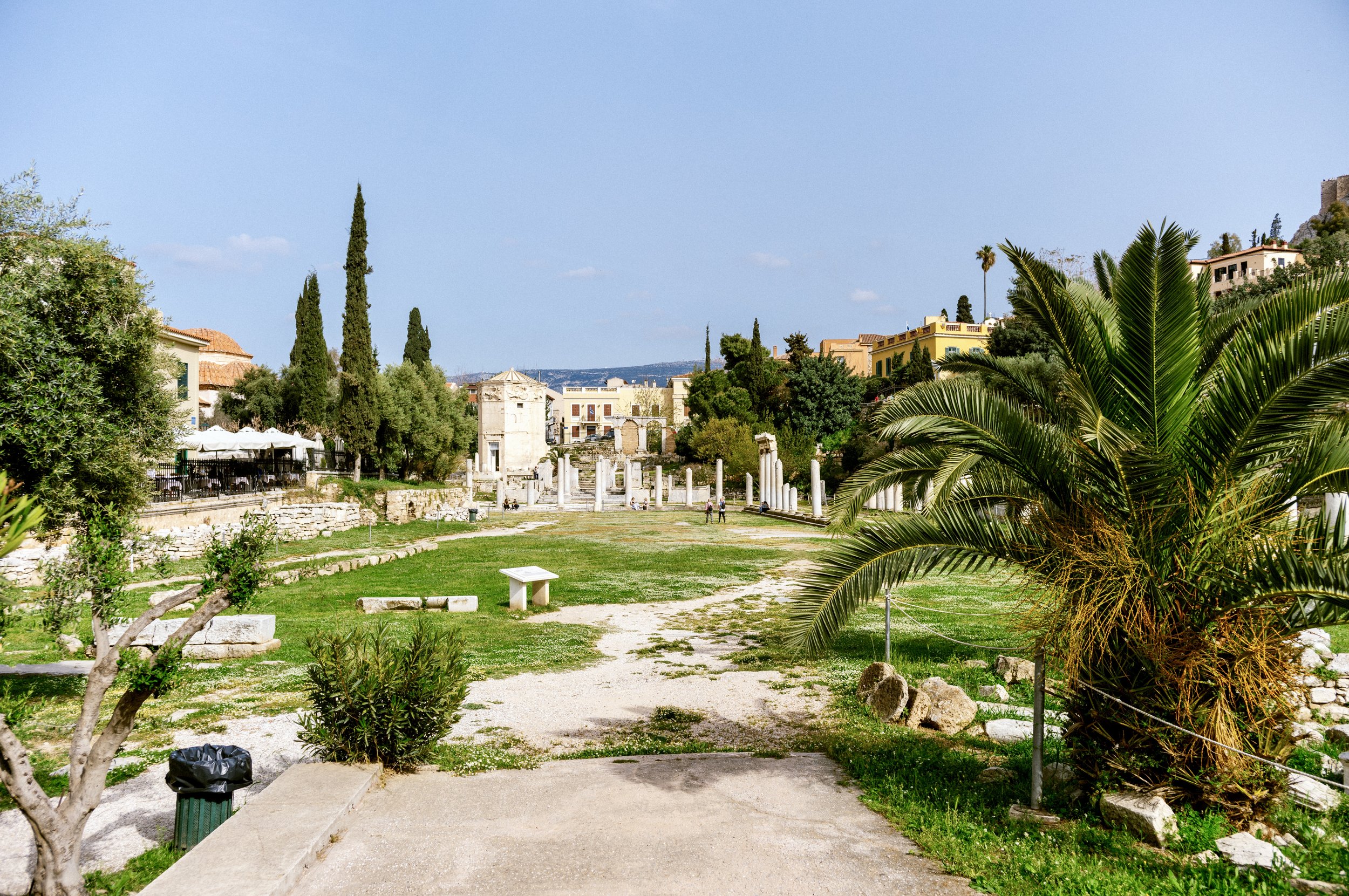 Tower of the Winds octagonal marble clocktower in the Roman Agora Athens Greece with Acropolis visible above