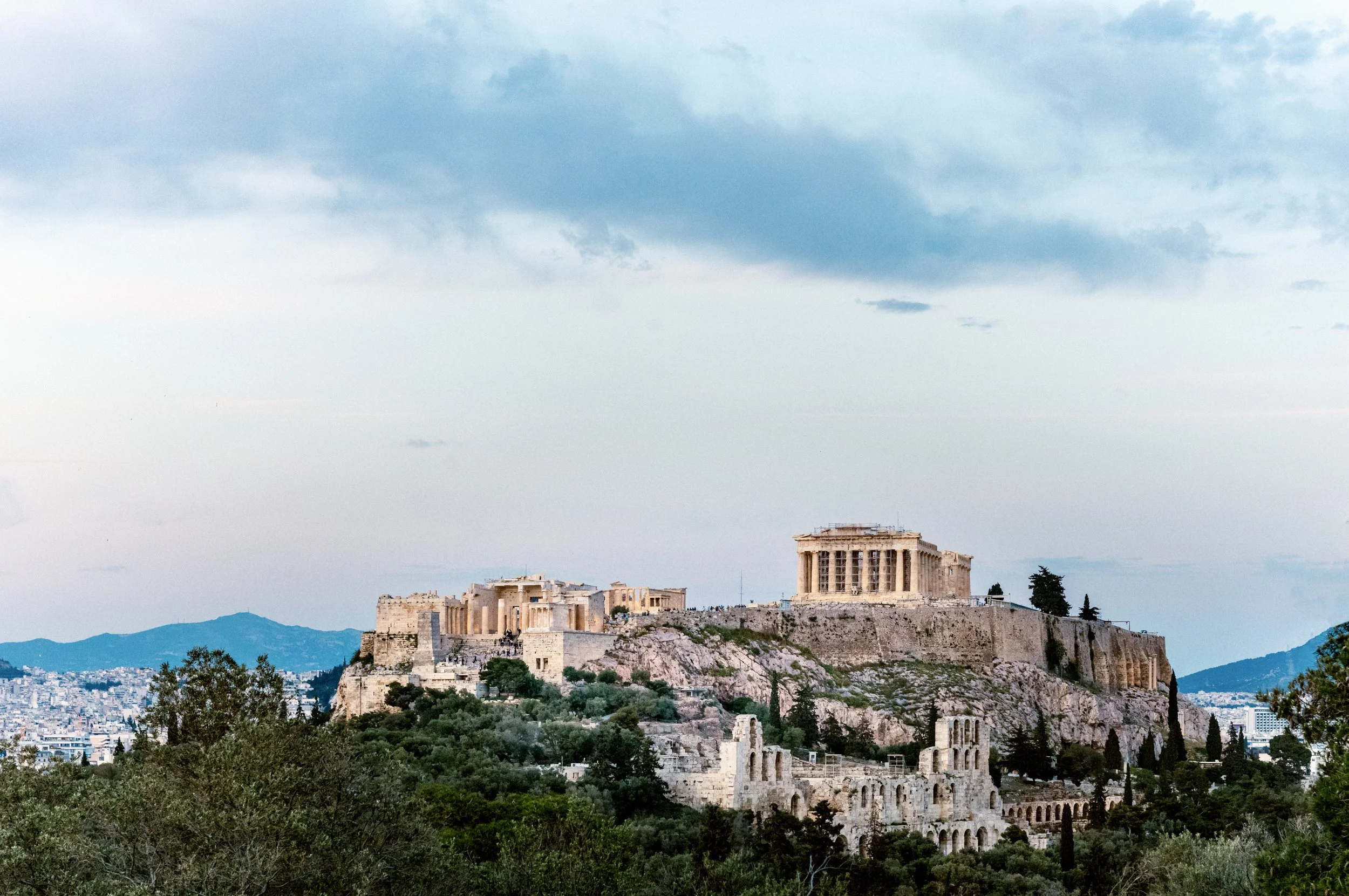 Acropolis and Parthenon lit at dusk photographed from Philopappos Hill southwest of Athens