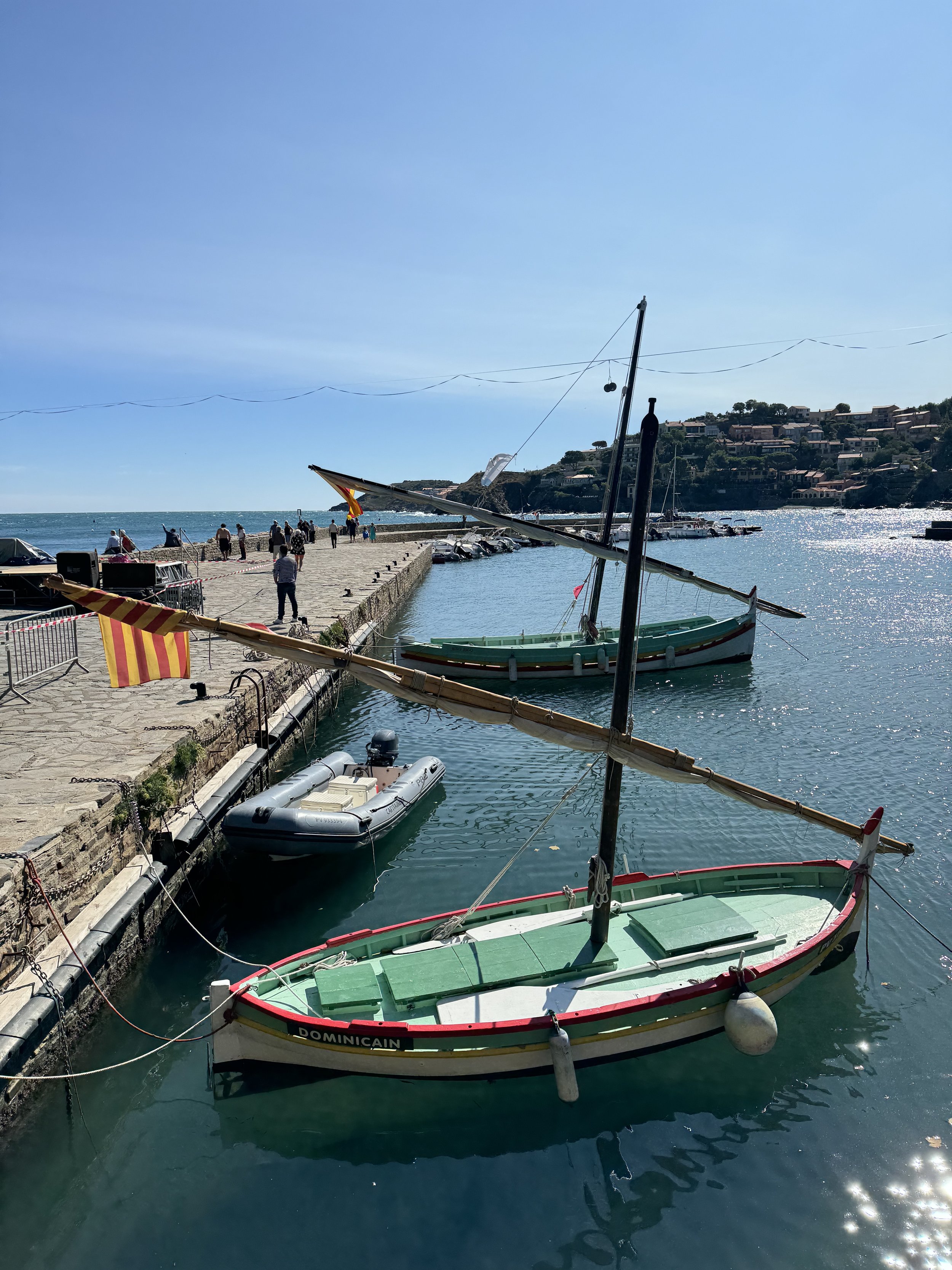 Sailboats in Collioure Port – dramatic seaside view with Mediterranean backdrop
