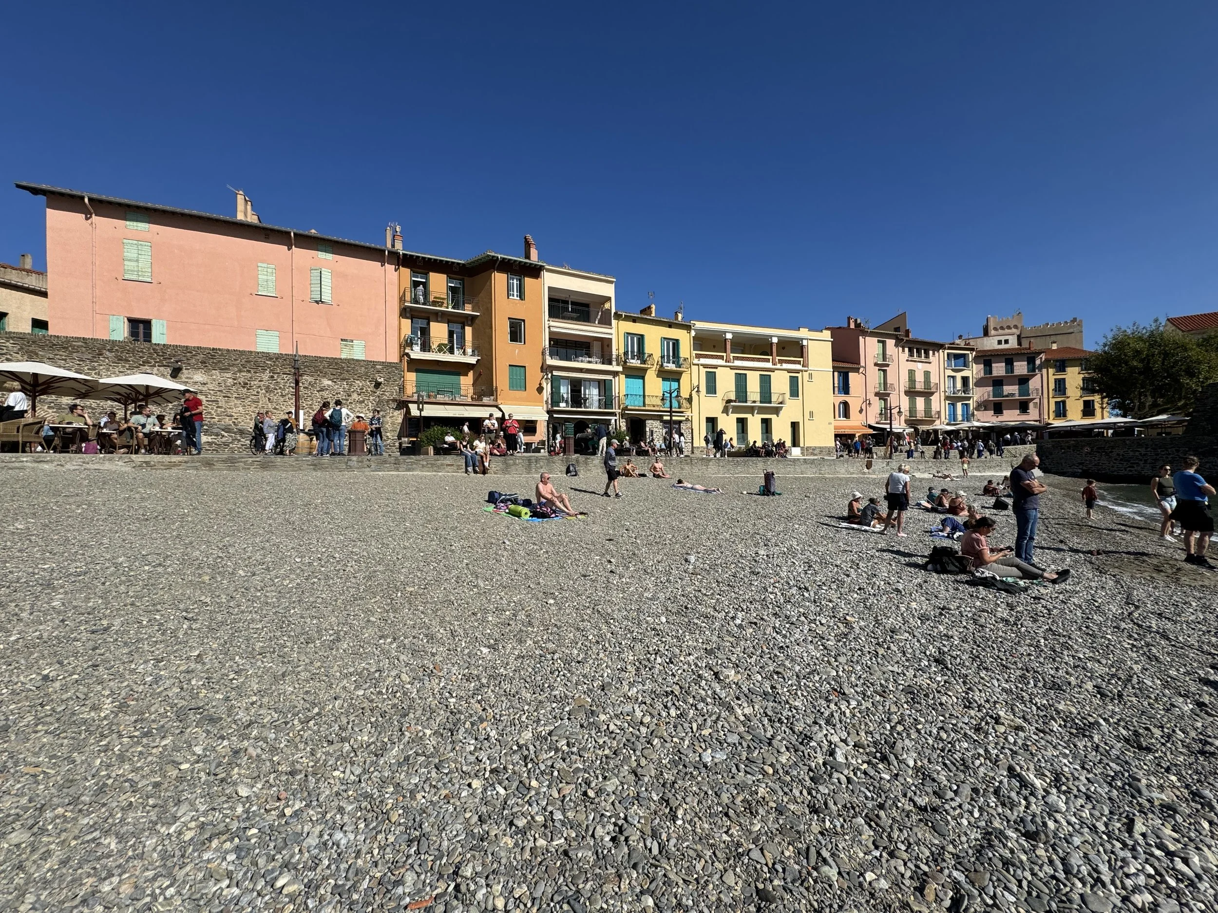 Plage de Collioure with locals and visitors enjoying the calm bay