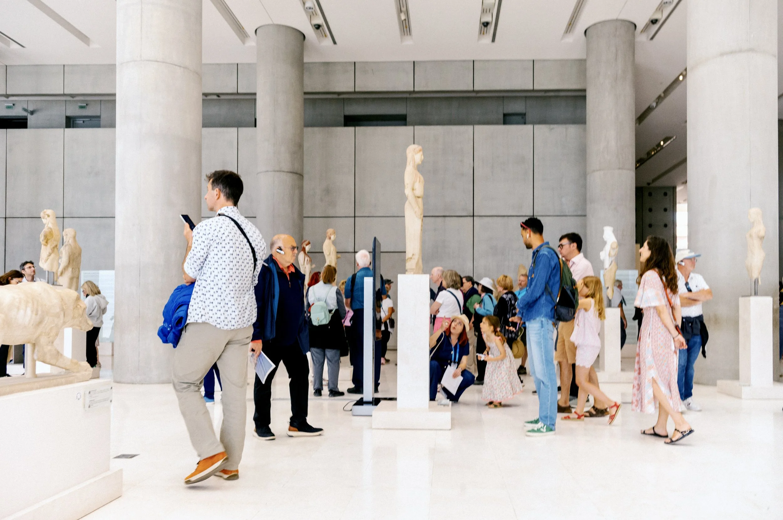 Interior of the Acropolis Museum Athens showing ancient Greek sculptures and architectural fragments