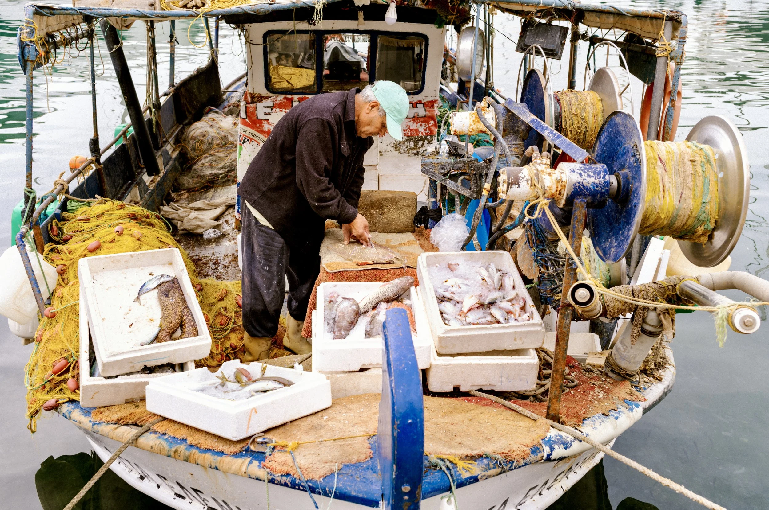Fisherman at Piraeus Port Athens Greece on the harbourside