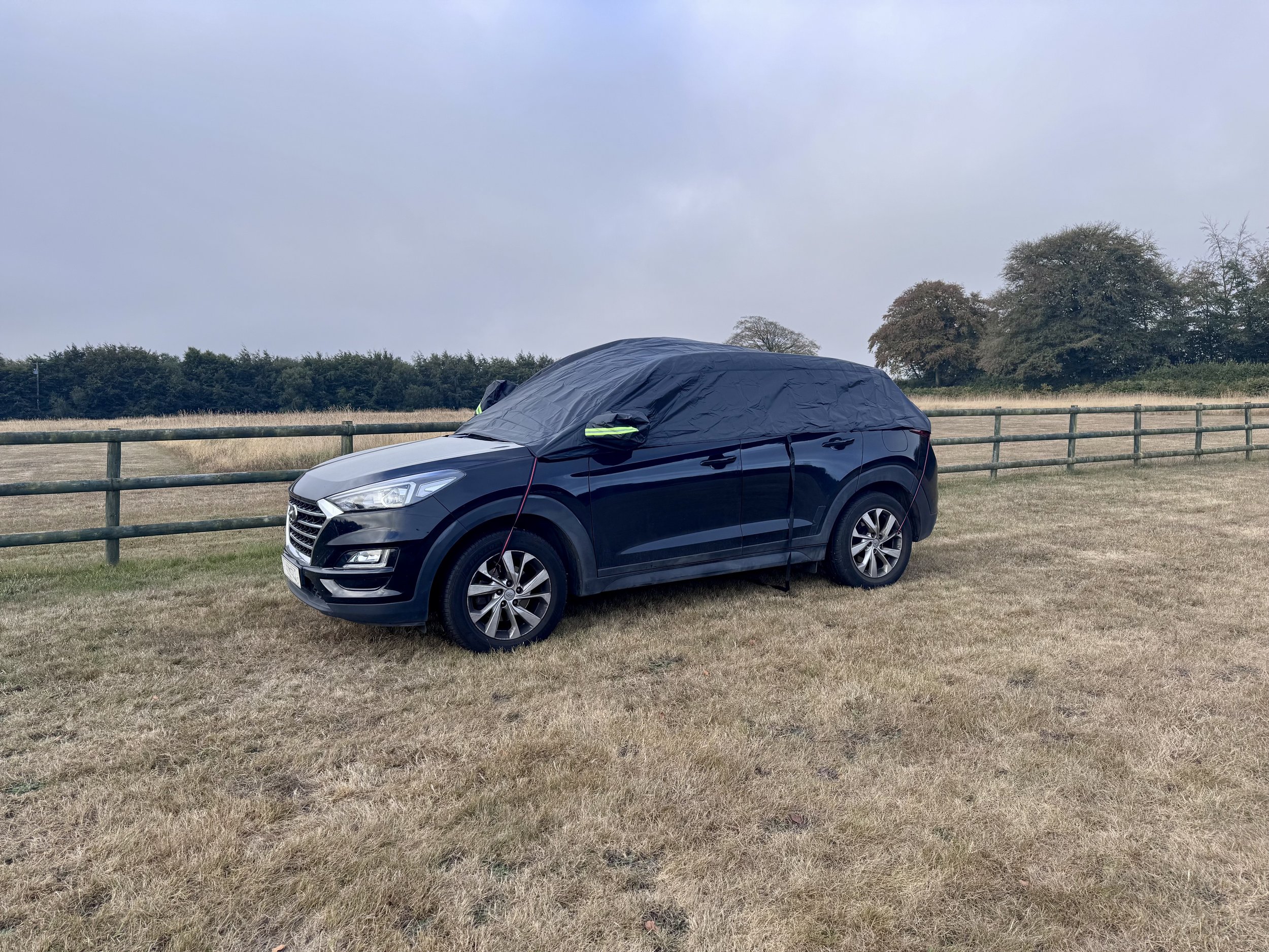 Car parked overnight in a field near Cornwall, an uncomfortable night's sleep before the road trip