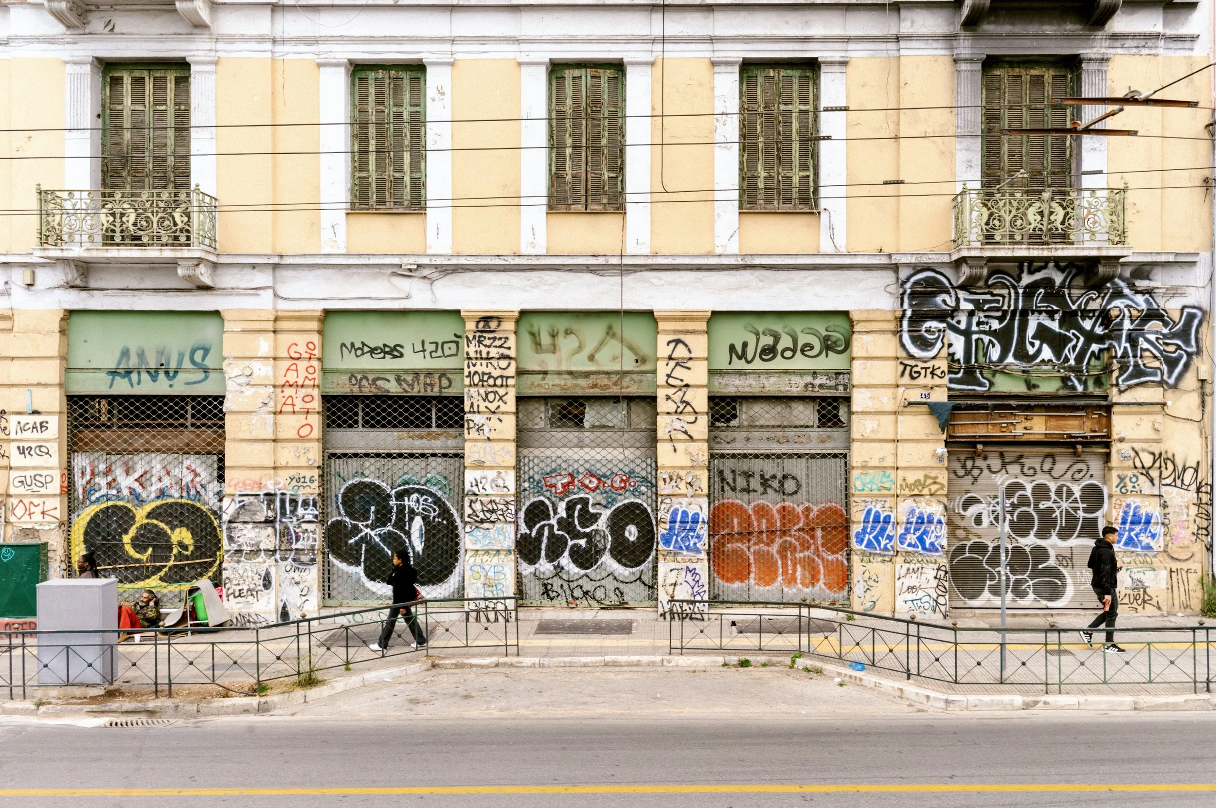 treet art and graffiti on building exterior in Athens Greece neighbourhood