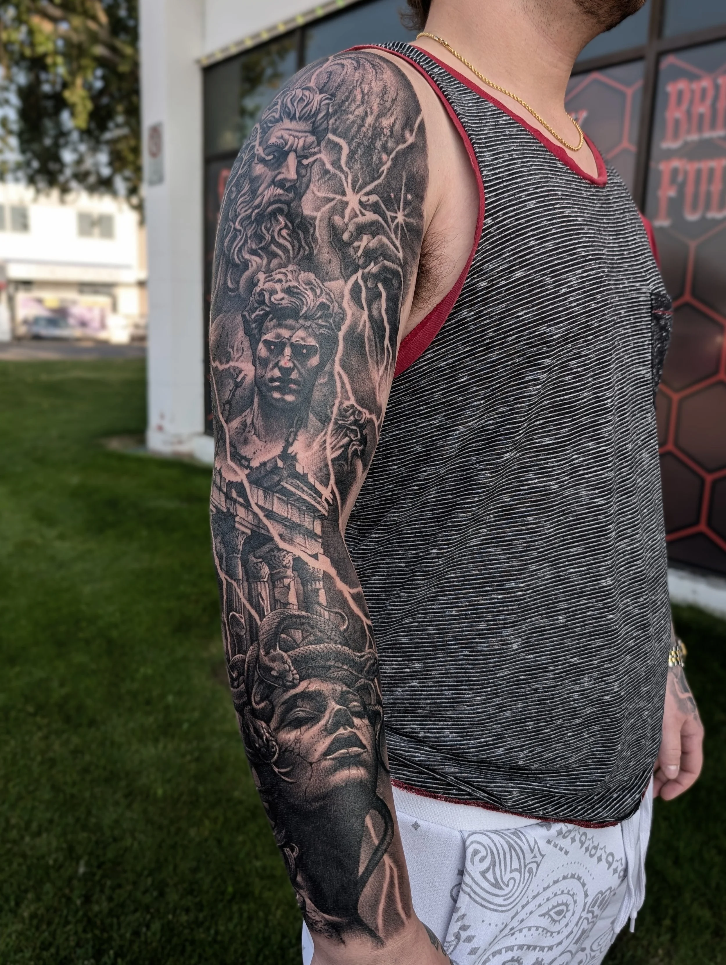 black and grey full sleeve tattoo of Greek gods 
