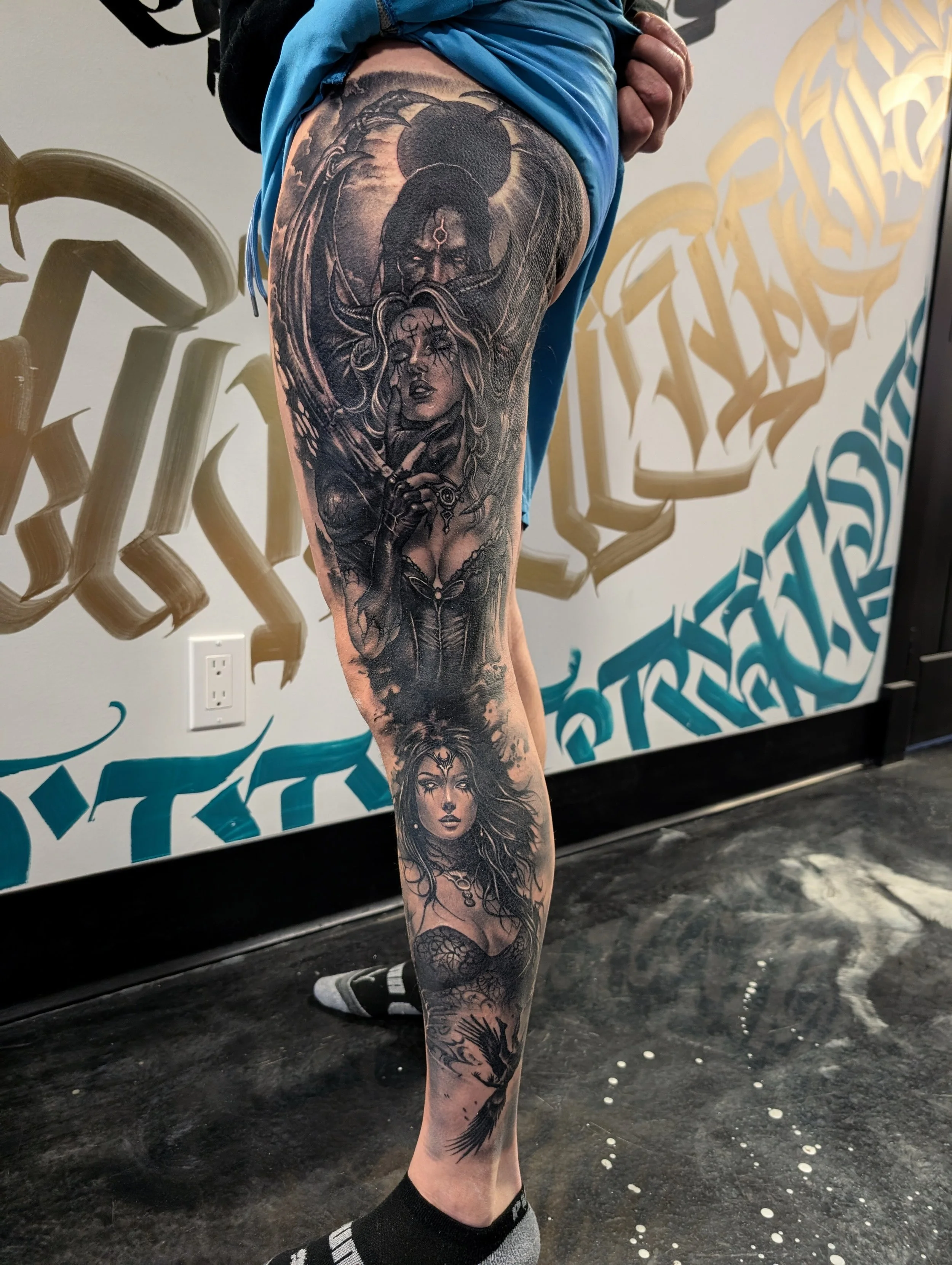 black and grey realism leg sleeve with female goddess, fallen angel, Lilith and Lucifer