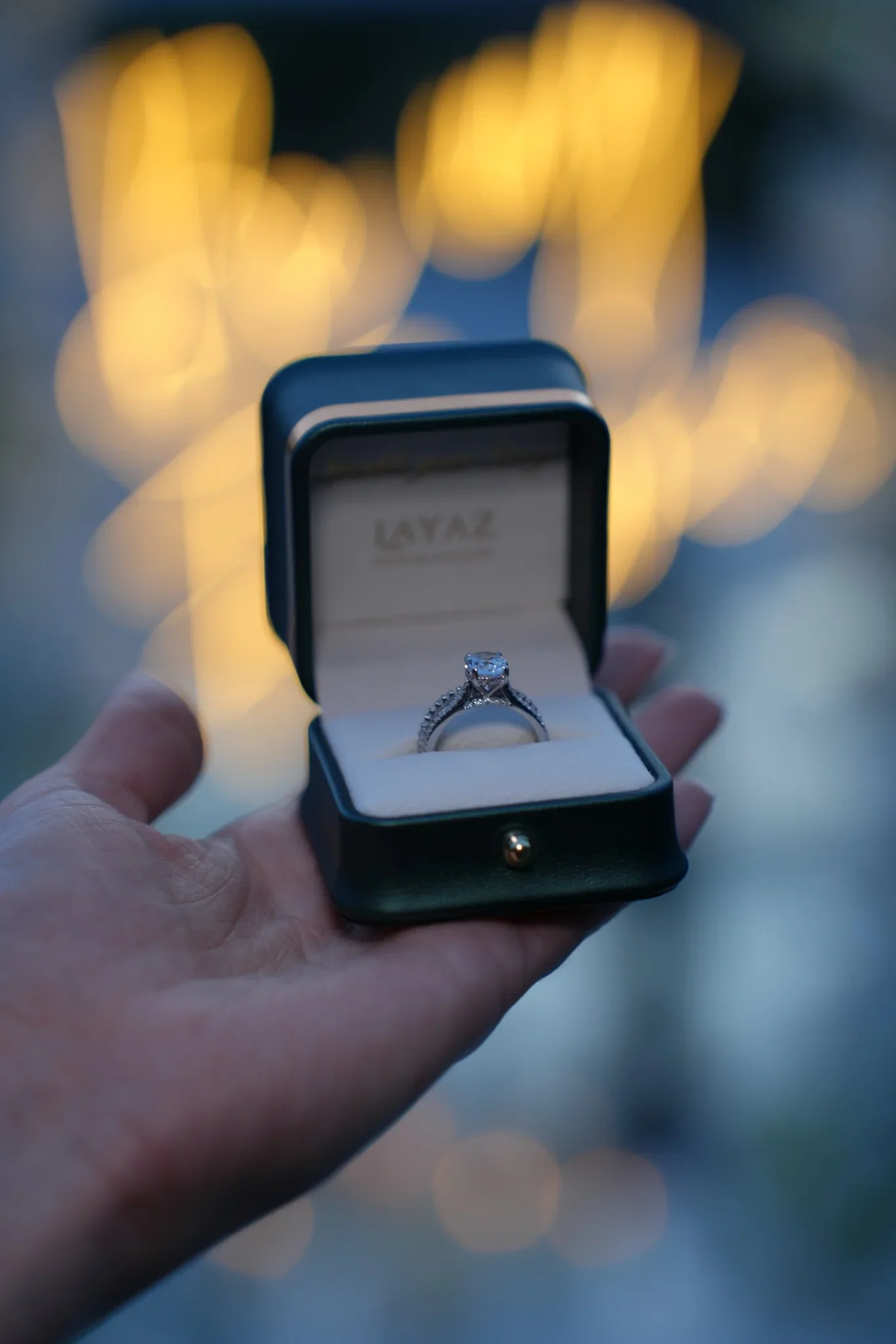 Luxury diamond engagement ring in a Layaz proposal box held in hand, symbolizing craftsmanship, elegance, and timeless quality.