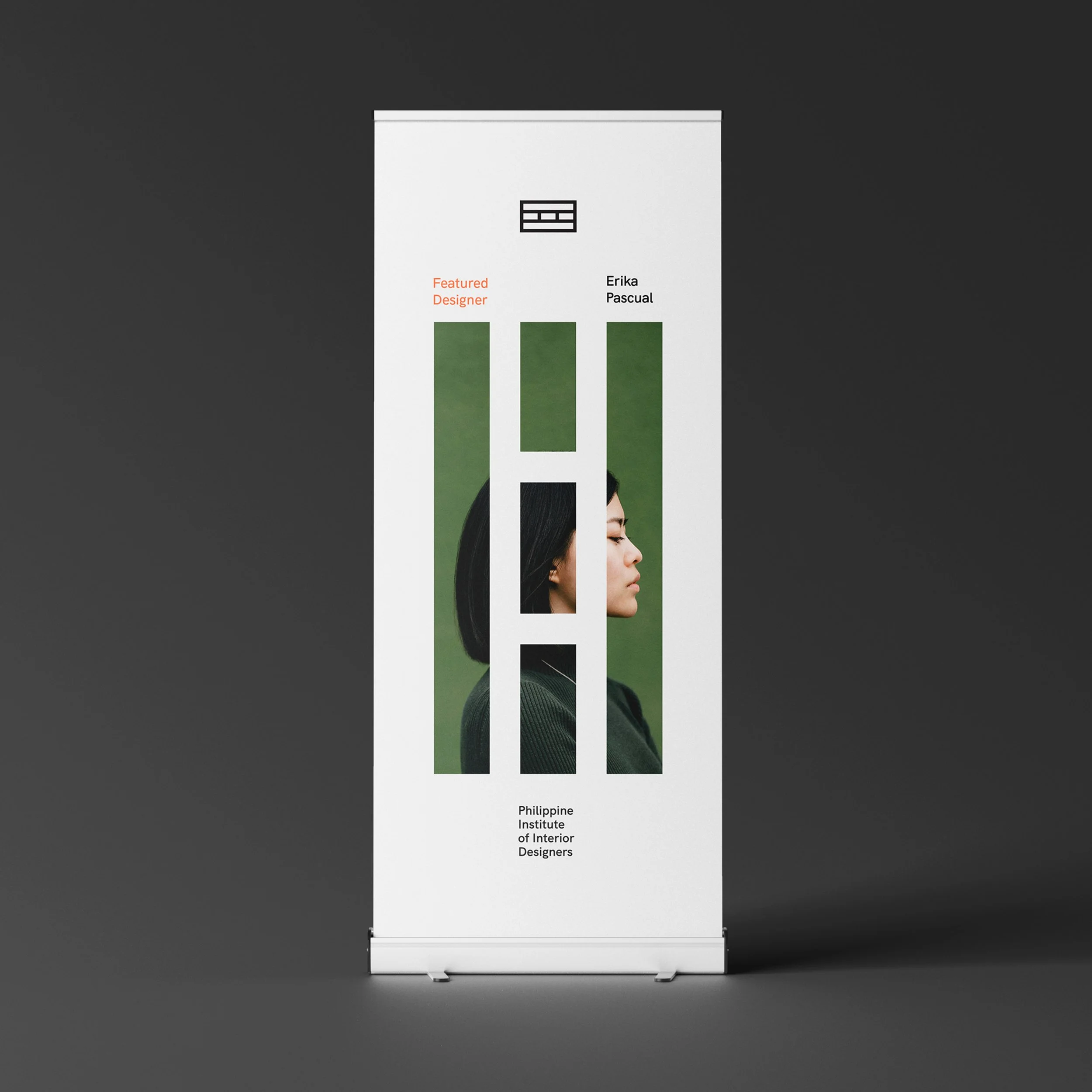 PIID roll-up banner with a white background, green geometric framing and Philippine Institute of Interior Designers branding.
