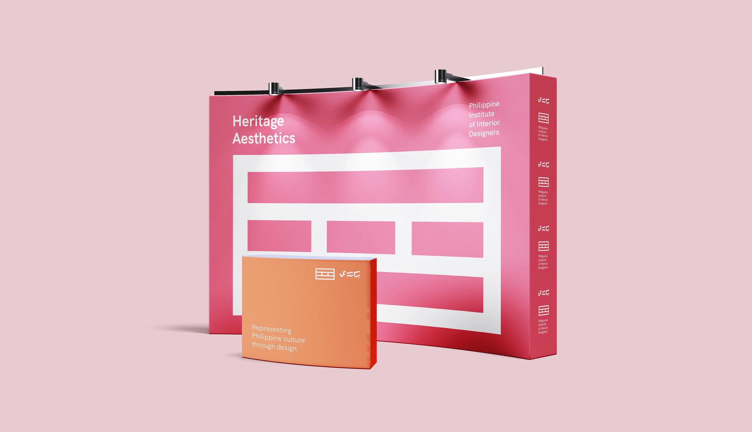 PIID Heritage Aesthetics exhibition booth mockup with pink modular graphics and an orange display counter.