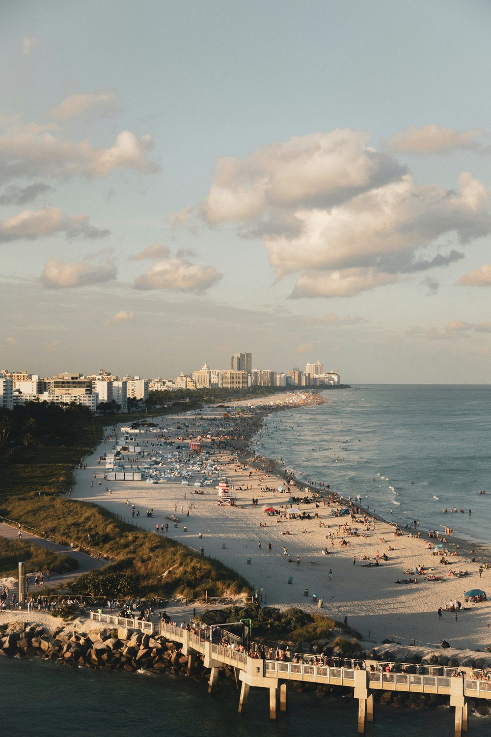 Beachgoers and umbrellas along South Beach in Miami, Florida