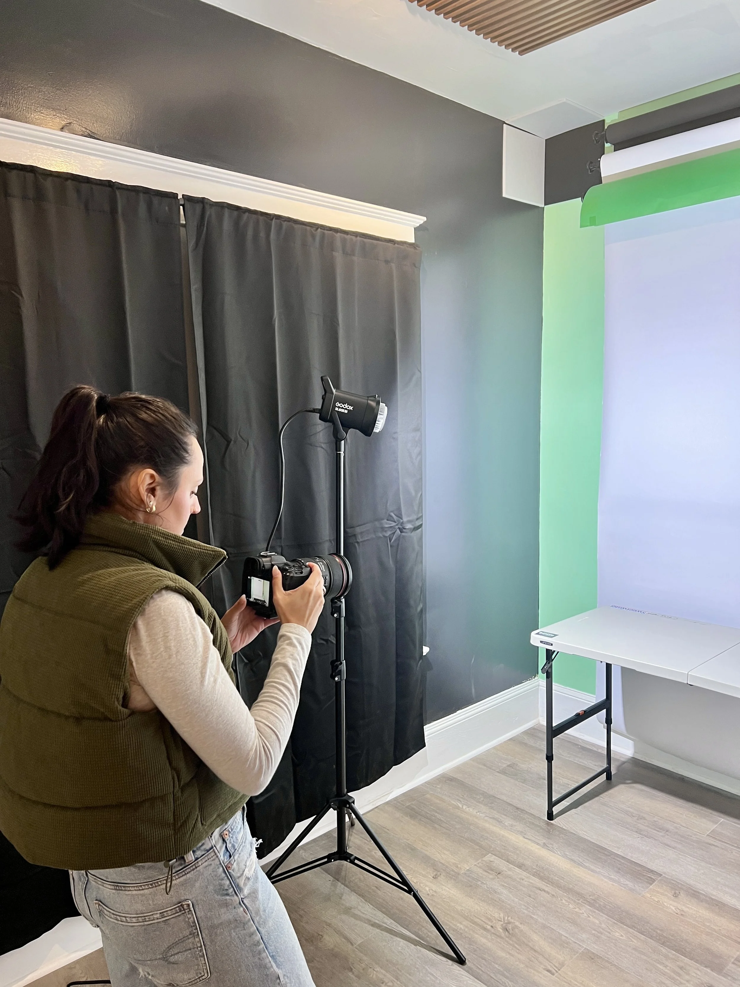 Girl taking a photo in a photography studio