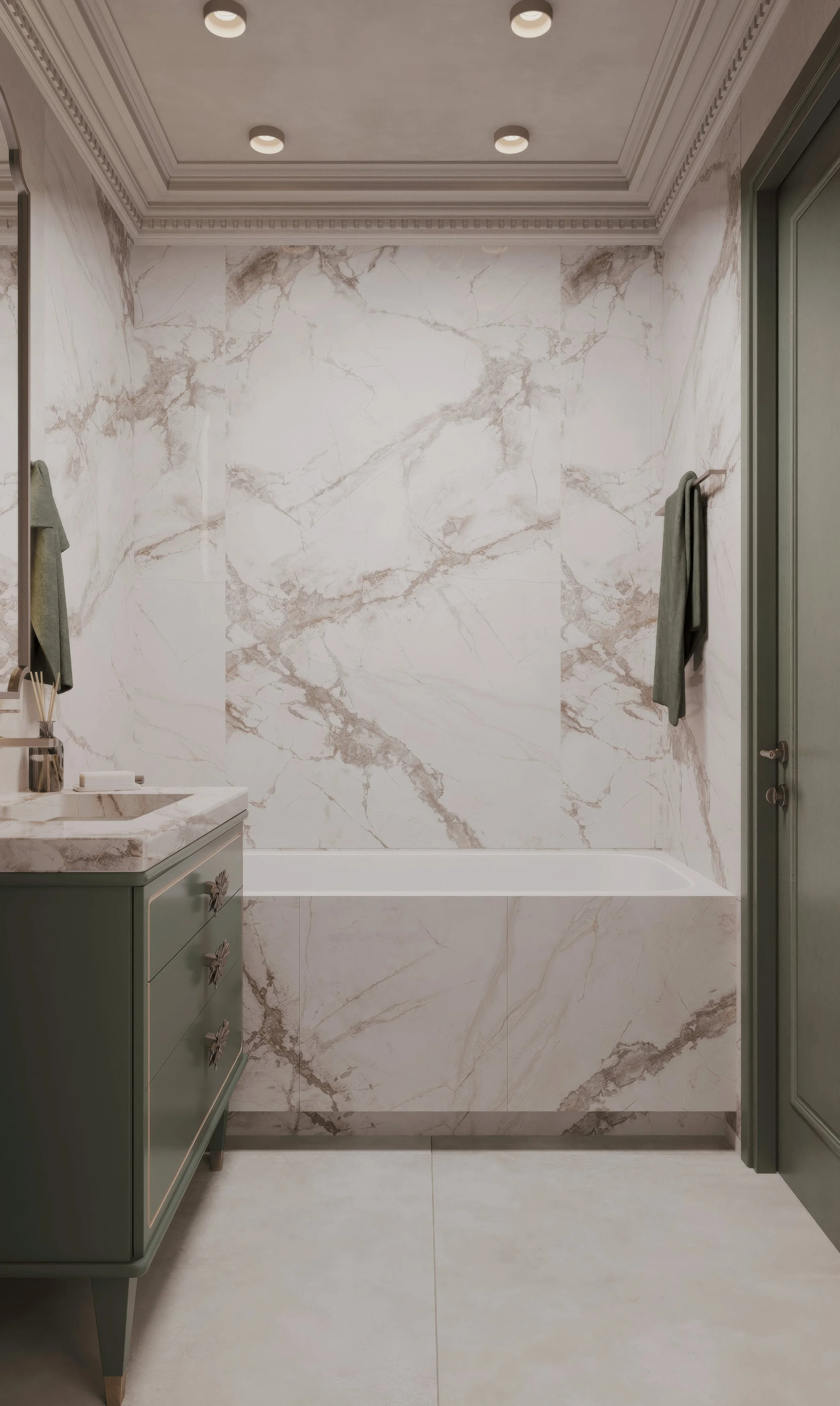 The custom vanity, finished in deep sage with floral brass hardware and fluted edging, adds a romantic character to the space, while the backlit arched mirror references historical silhouettes in a modern interpretation. A freestanding tub and walk-i