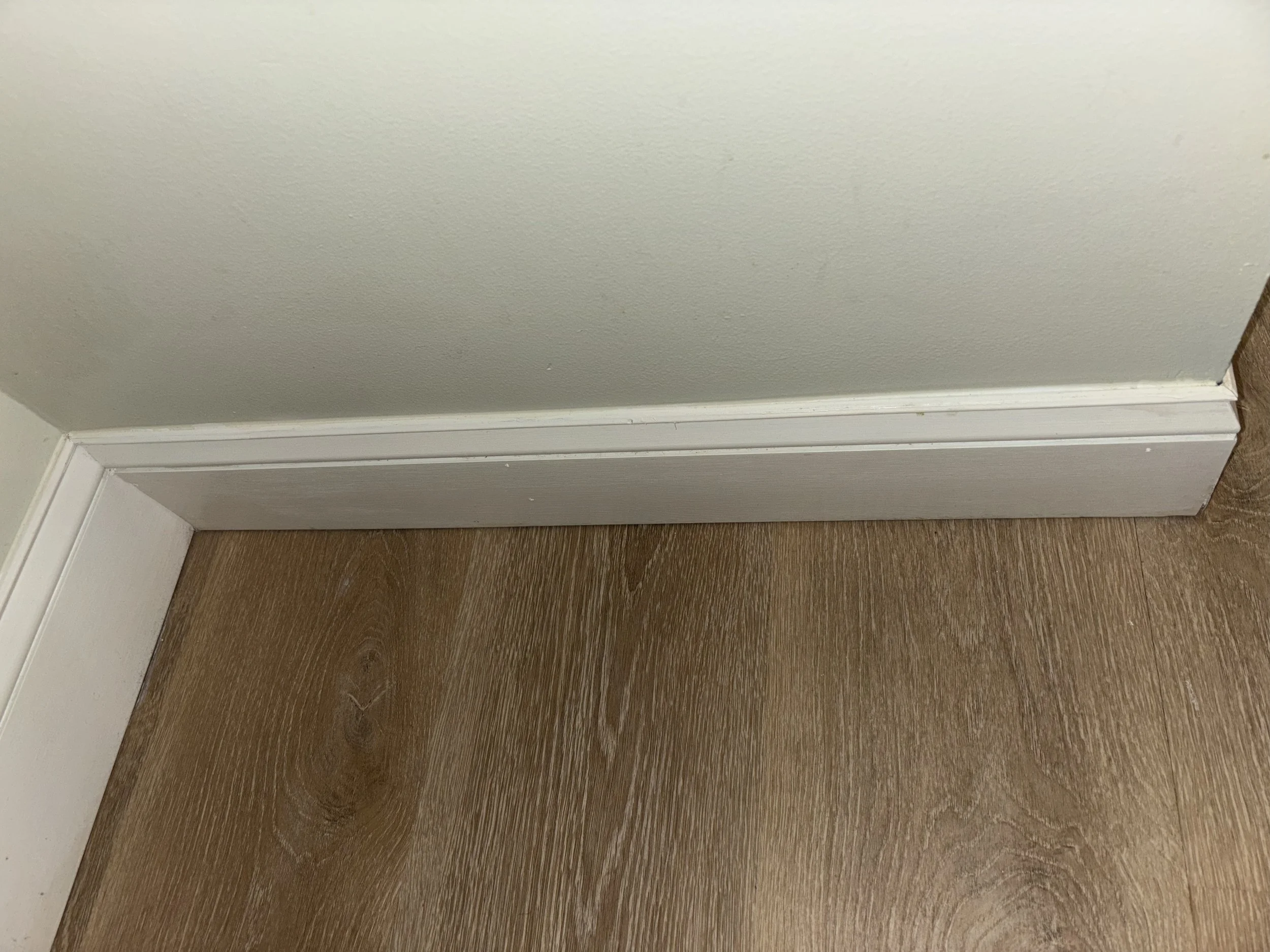 Close-up of a baseboard cleaned after removed stains.