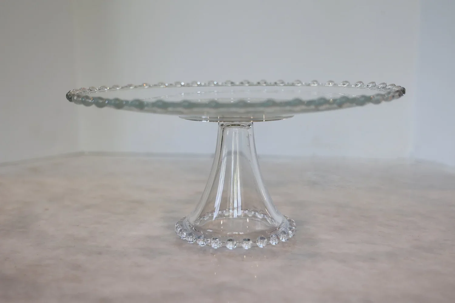 VINTAGE CRYSTAL CAKE PLATE WITH ORNAMENTAL TRIM - SOLD