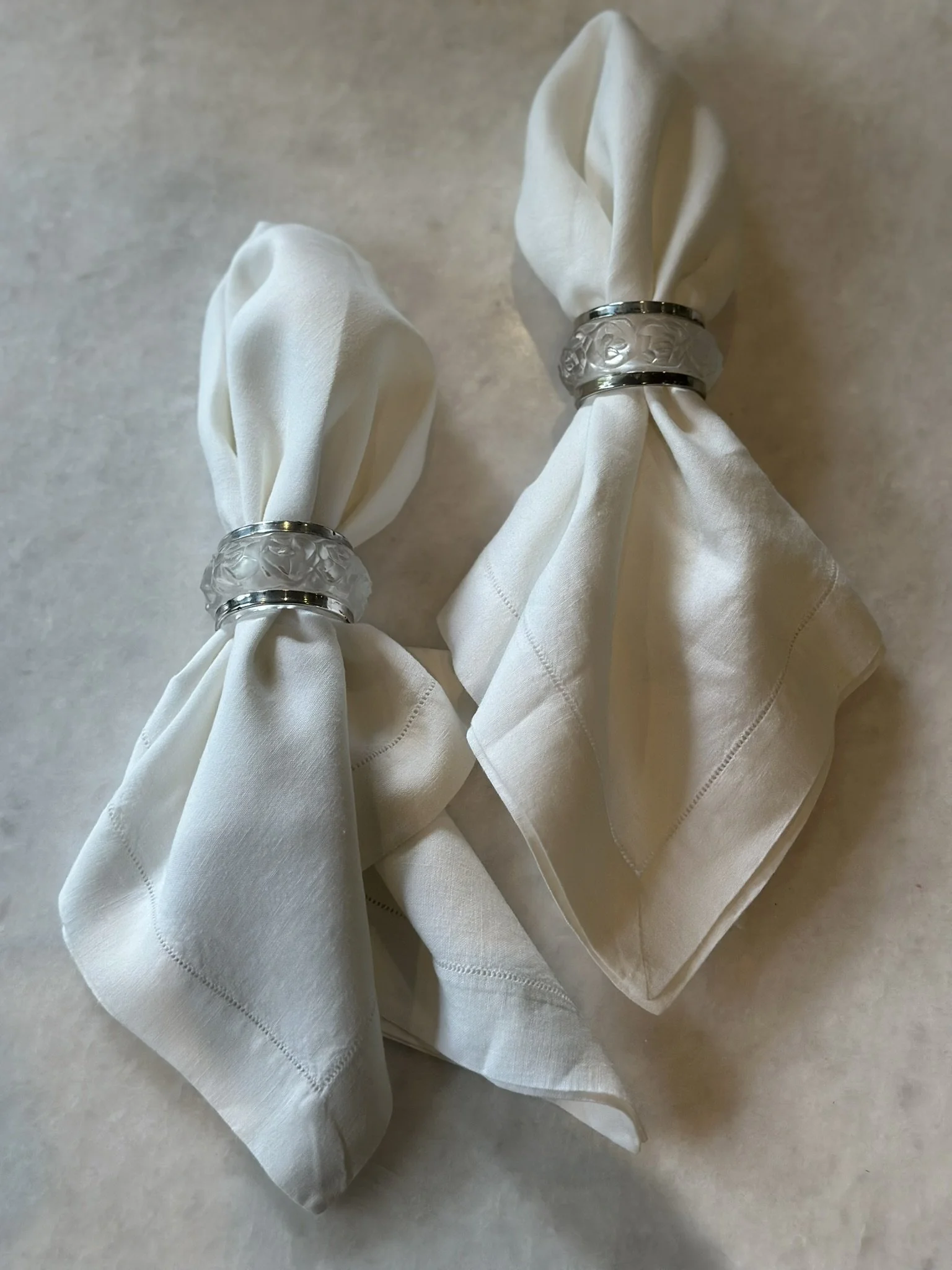 CRYSTAL AND SILVERPLATE NAPKIN RINGS  