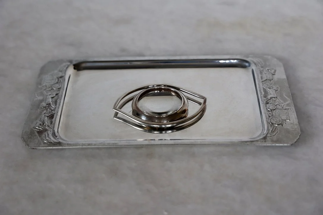 HERMES JEAN COCTEAU OEUILLE DE CLEOPATRA MAGNIFYING LOOP IN GUNMETAL ON VINTAGE TRAY (SOLD SEPARATELY) 