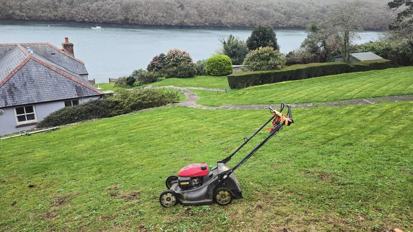 Lawn mowing and garden maintenance on a large riverside garden in Cornwall