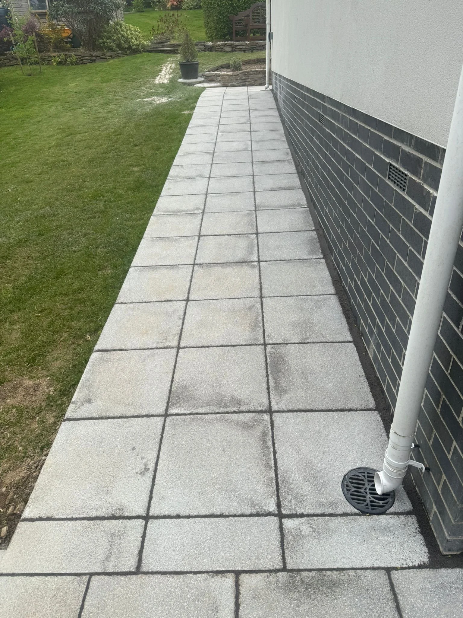 New paved garden path beside a property in Cornwall