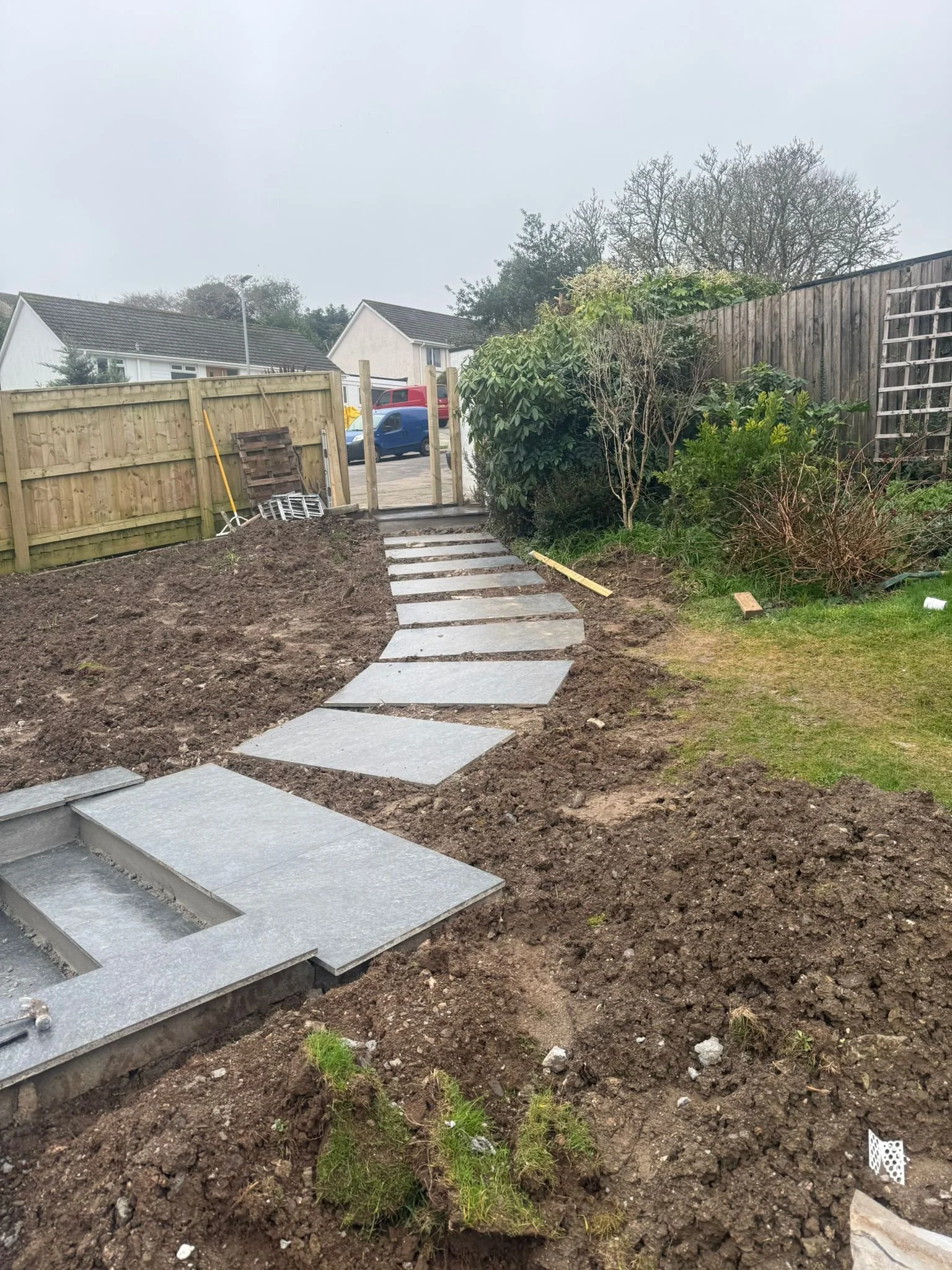 Porcelain garden steps and stepping stone pathway under construction during Cornwall landscaping project