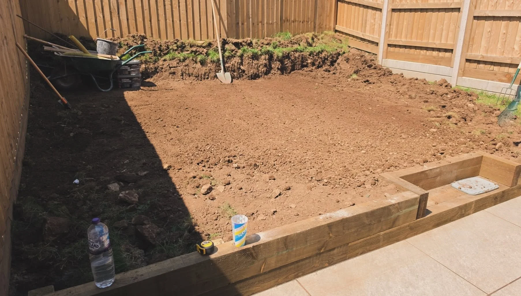 Garden prepared for landscaping with freshly levelled soil ready for turfing and planting by a landscape gardener in Cornwall.