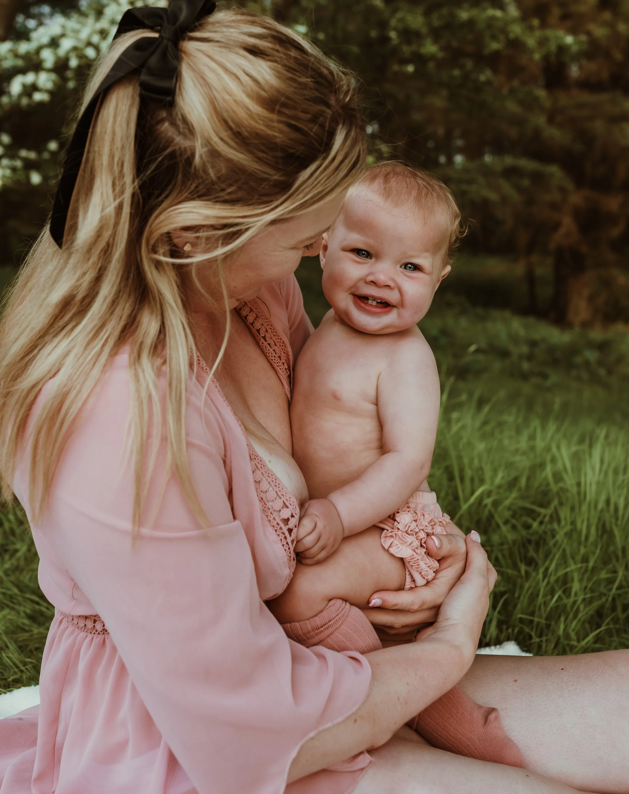 Mother and toddler sharing a tender moment during a nursing photography session in Scotland with Marieke Captures Birth