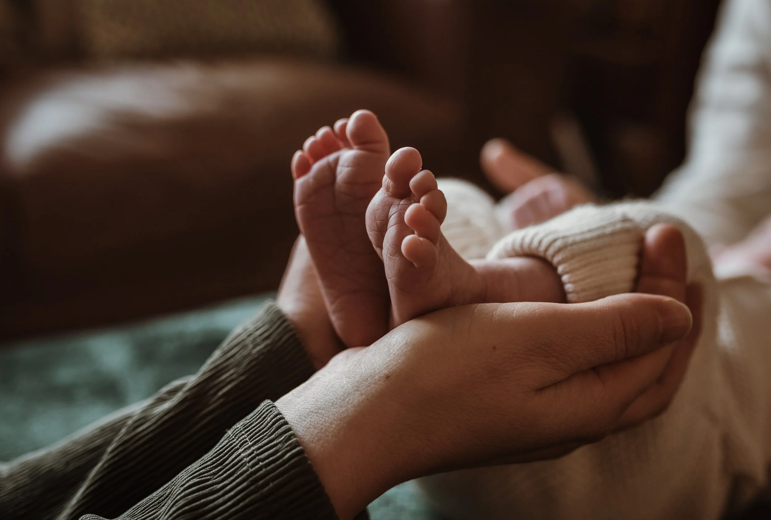 Soft natural light falling on newborn baby at home photographed by Glasgow newborn photographer