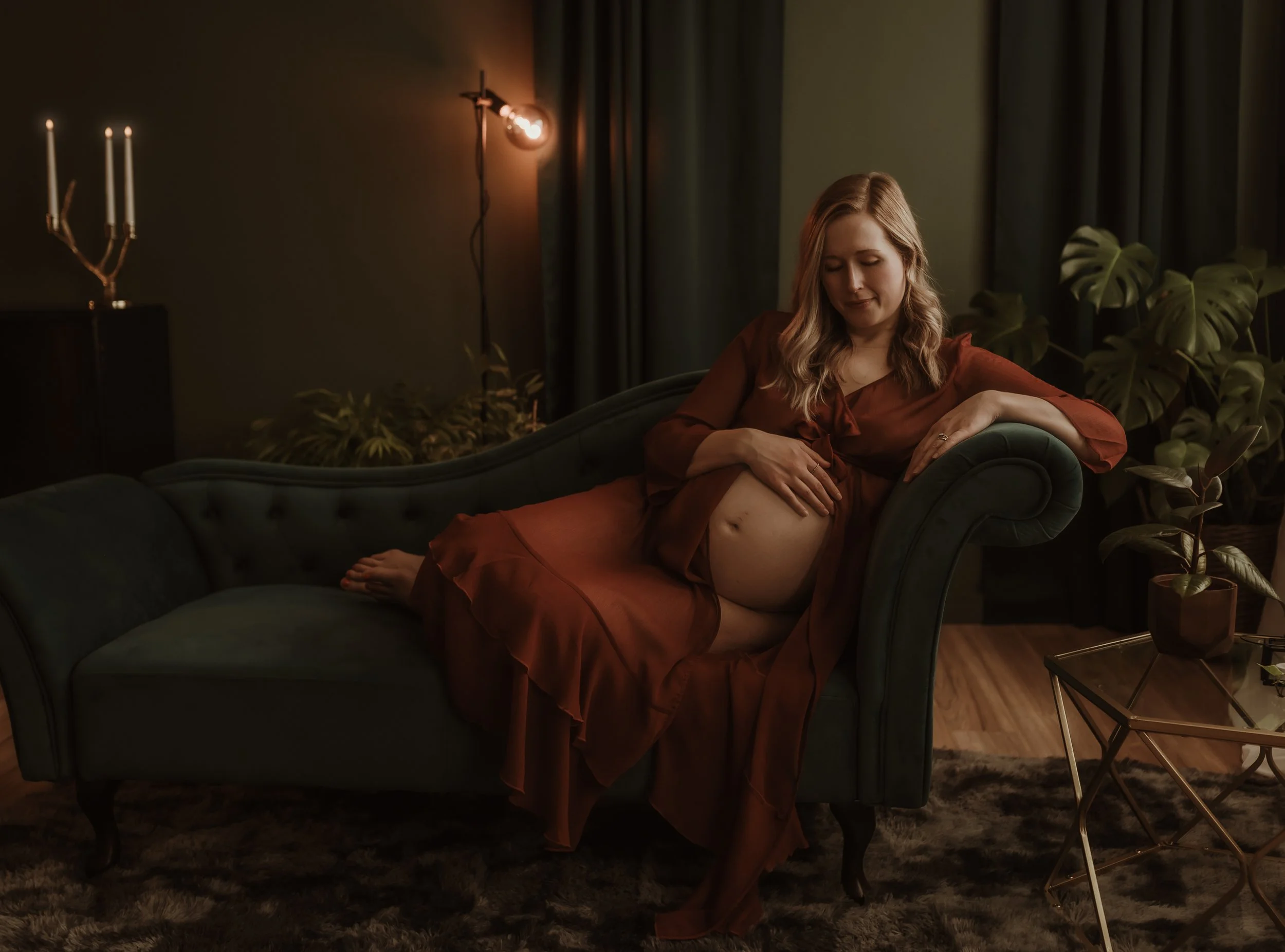 Pregnant mother standing peacefully during a solo studio maternity session in Glasgow, reconnecting with her pregnancy in soft natural light before her home birth in Scotland.