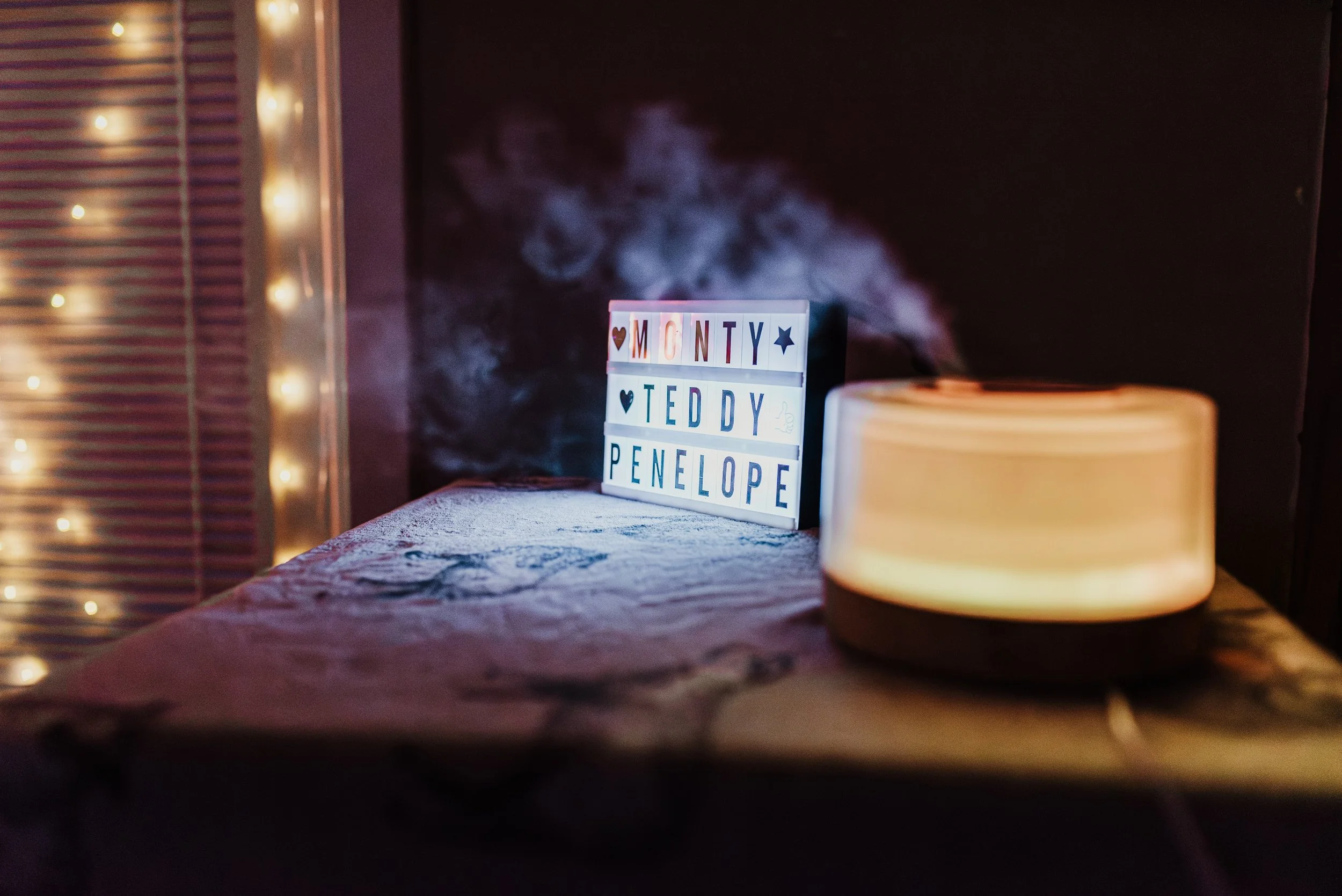 Cosy home birth space in Ayr Scotland with fairy lights, birth pool and soft lighting prepared for a summer water birth