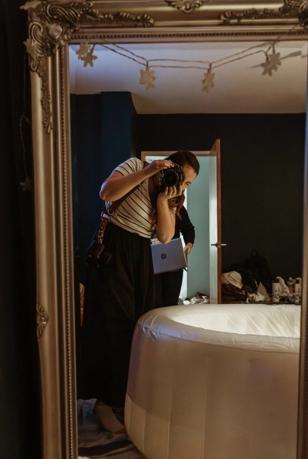 Marieke Gortemaker photographing in a birth space, camera in hand — documentary birth photographer Glasgow