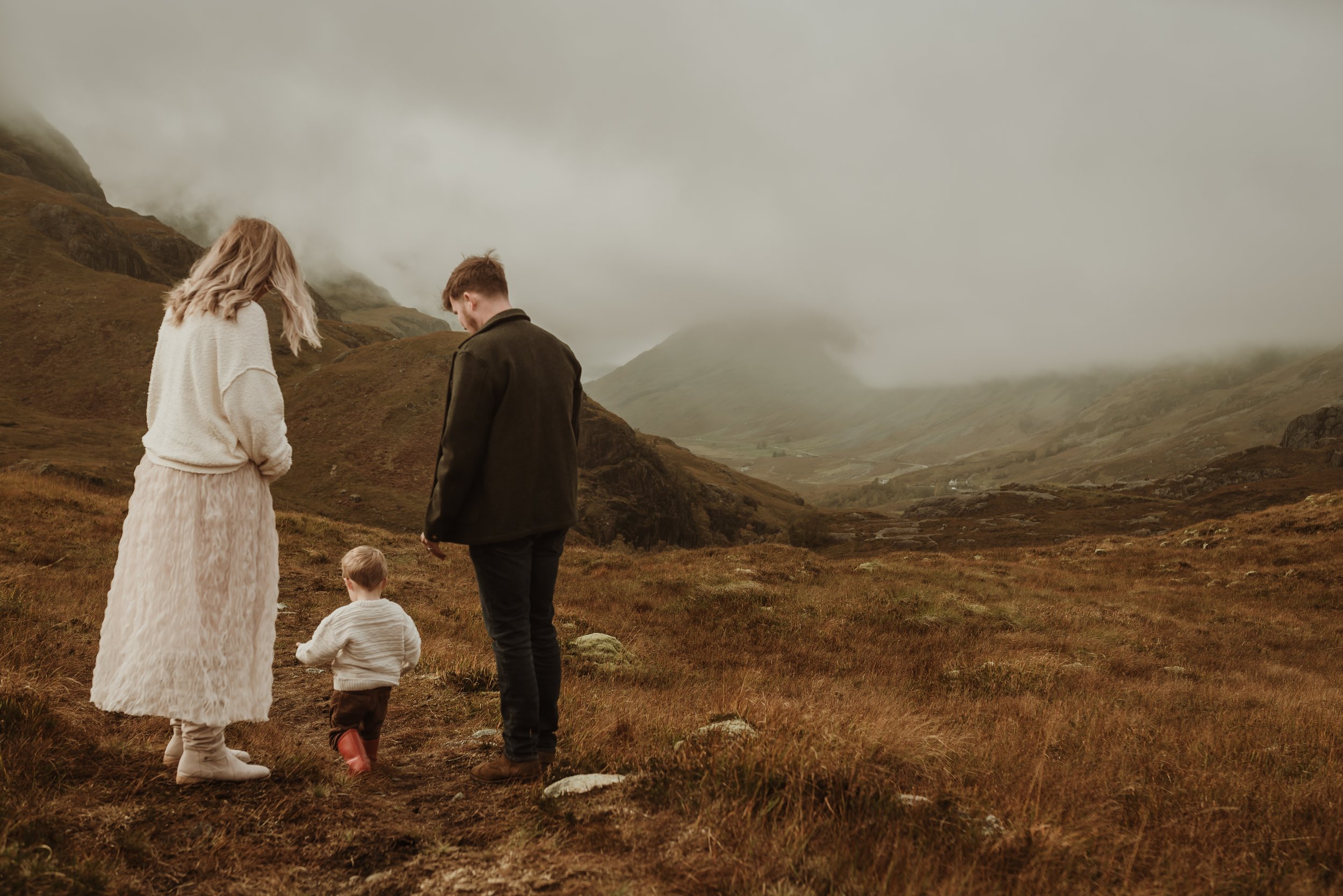 Family maternity session in Glencoe Scotland with toddler exploring the Highlands