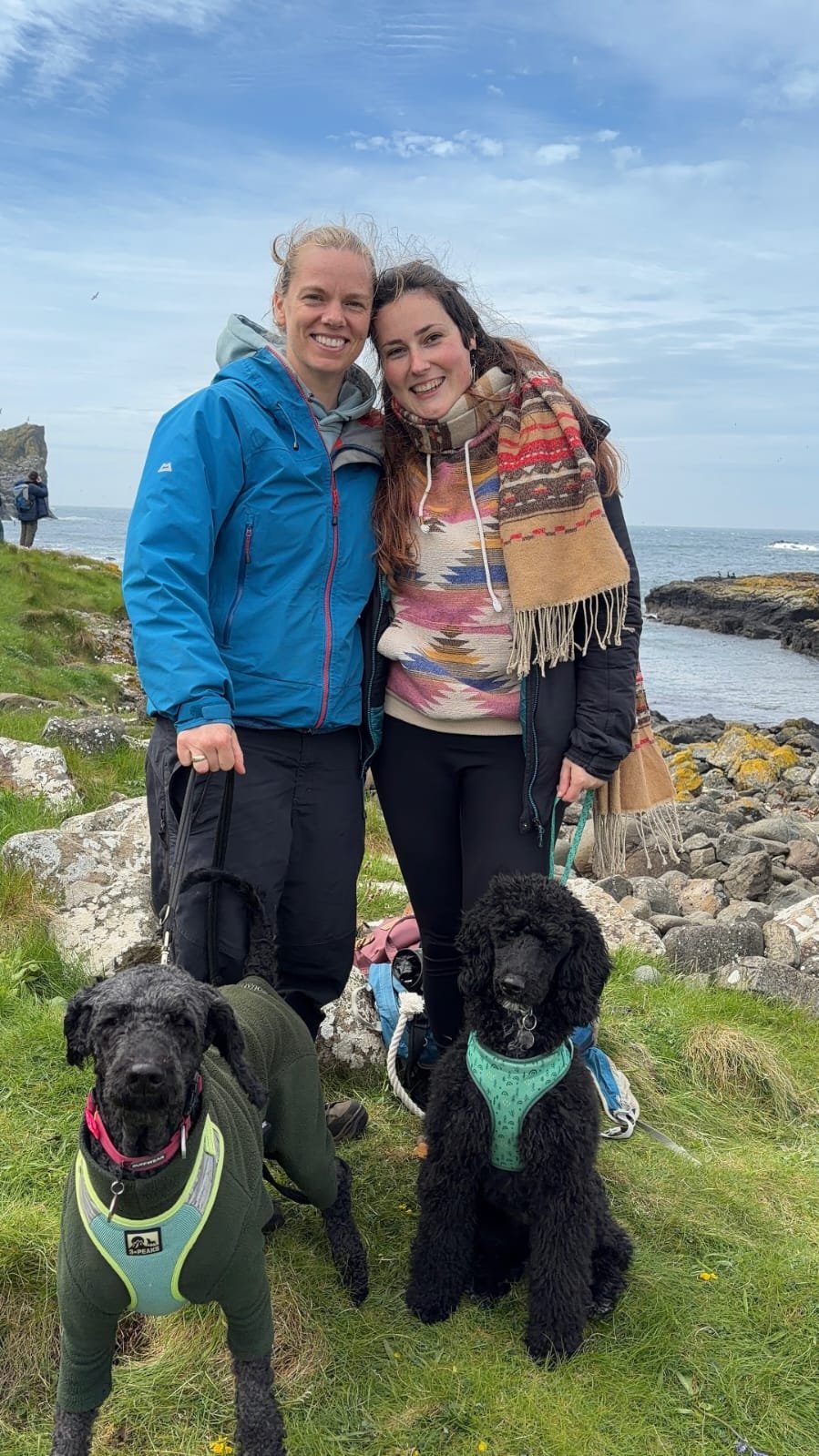 Marieke Gortemaker with partner Dawn and dogs Bramble and Nevis on the Scottish coast — birth photographer Glasgow