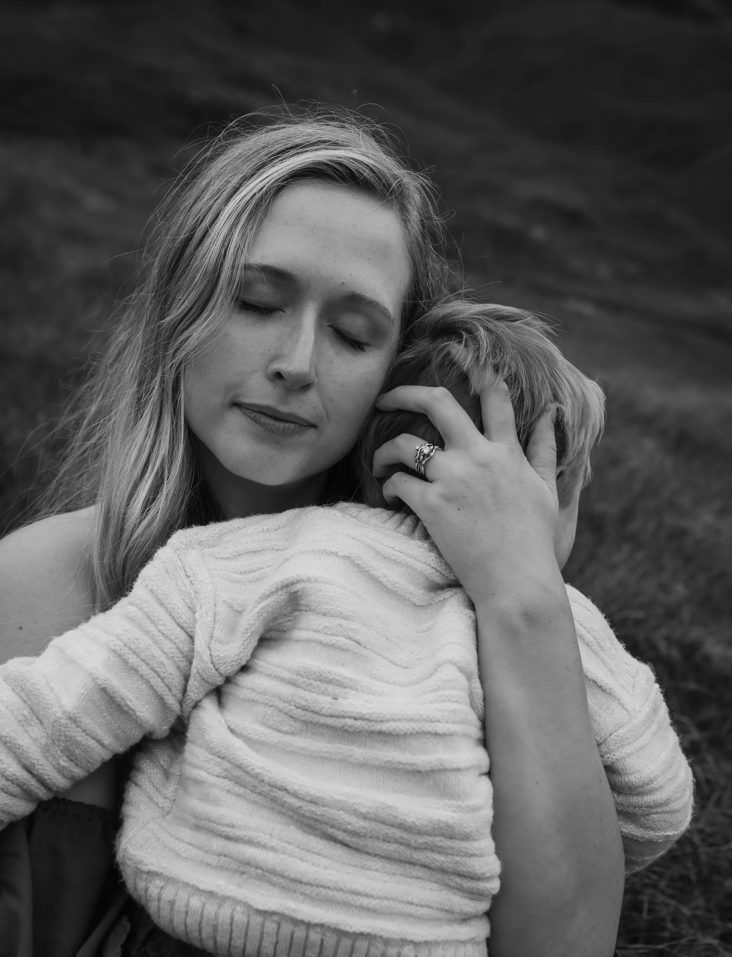 Tender maternity moment captured in Glencoe Scotland by Glasgow maternity photographer