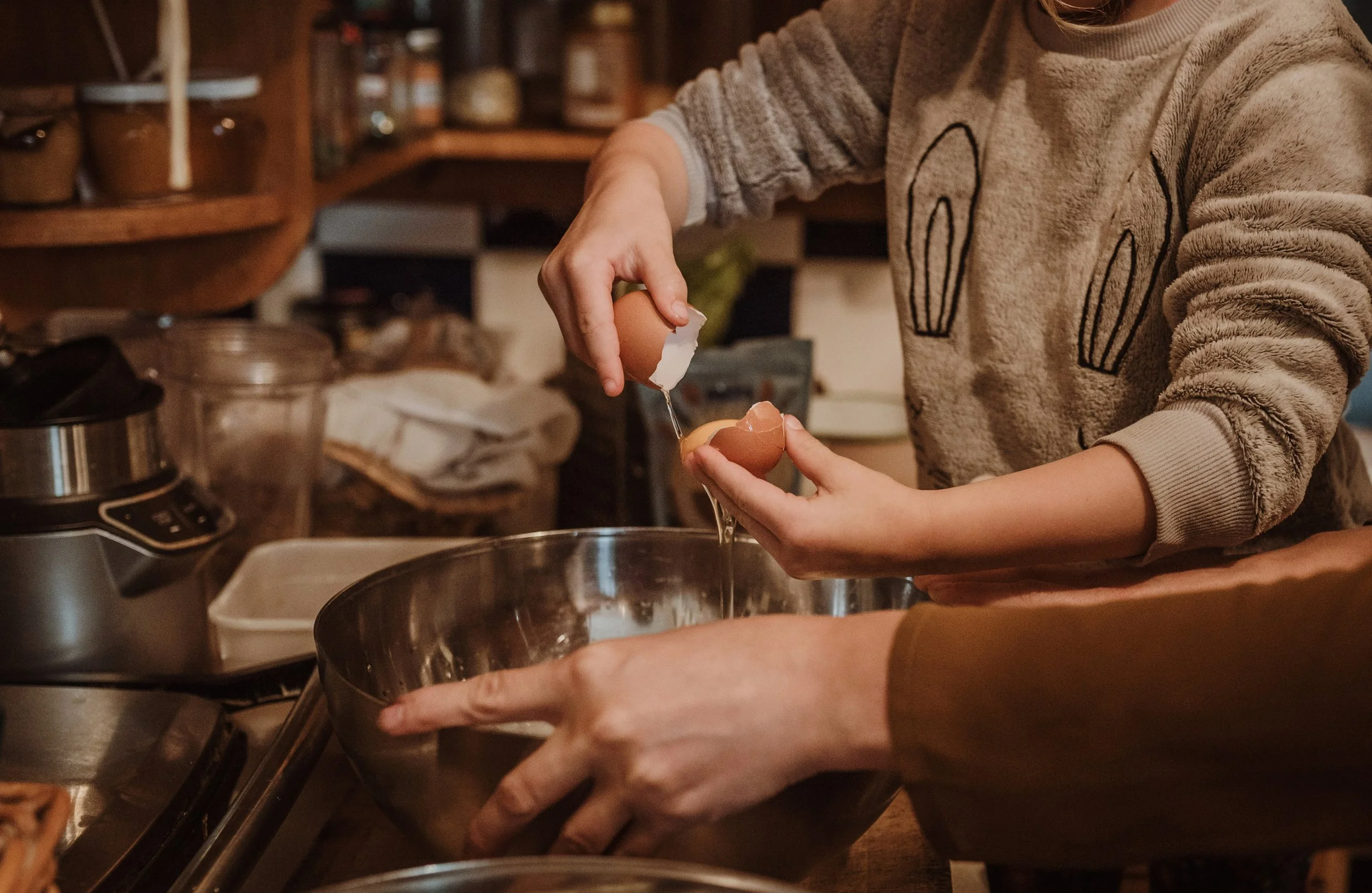 Family baking together during a cosy at-home maternity session in the Scottish Borders, captured by birth photographer Marieke Captures Birth