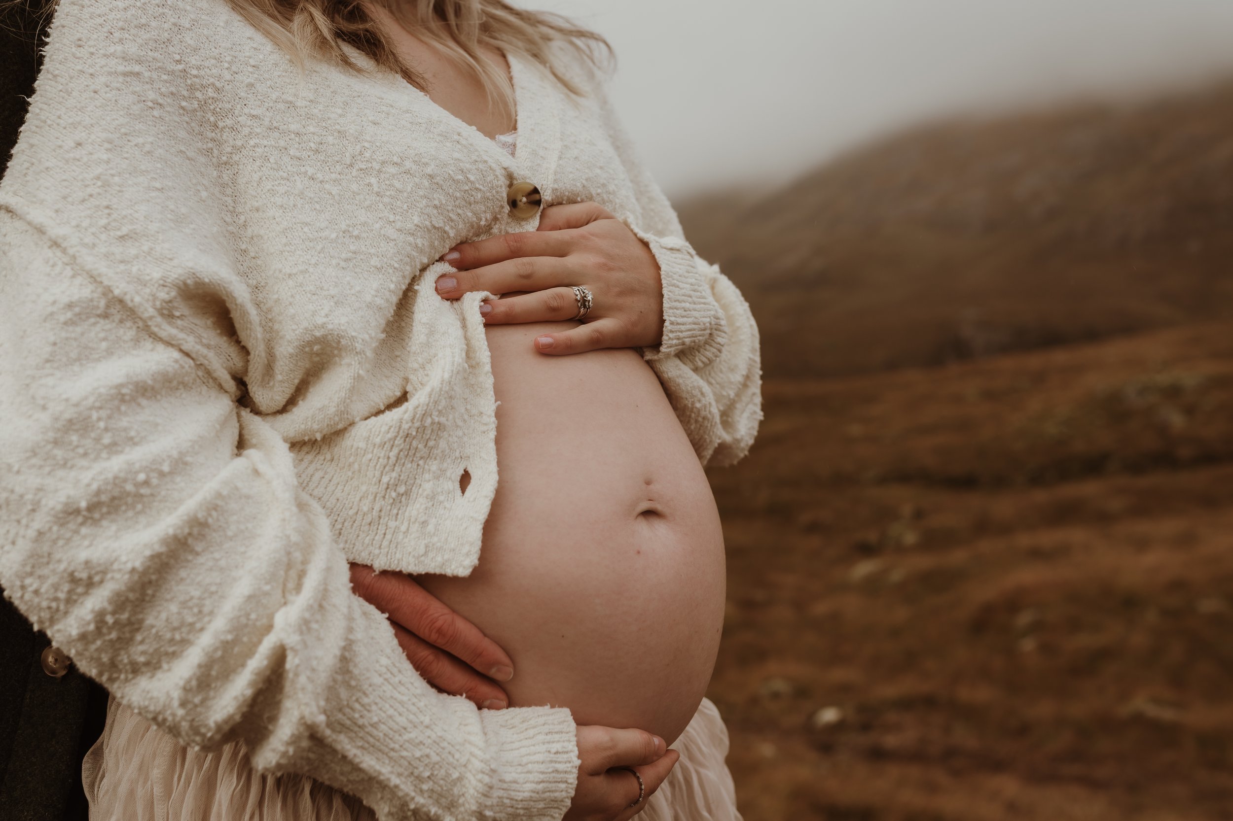 Outdoor maternity photography in Glencoe Scotland with dramatic Highland landscape