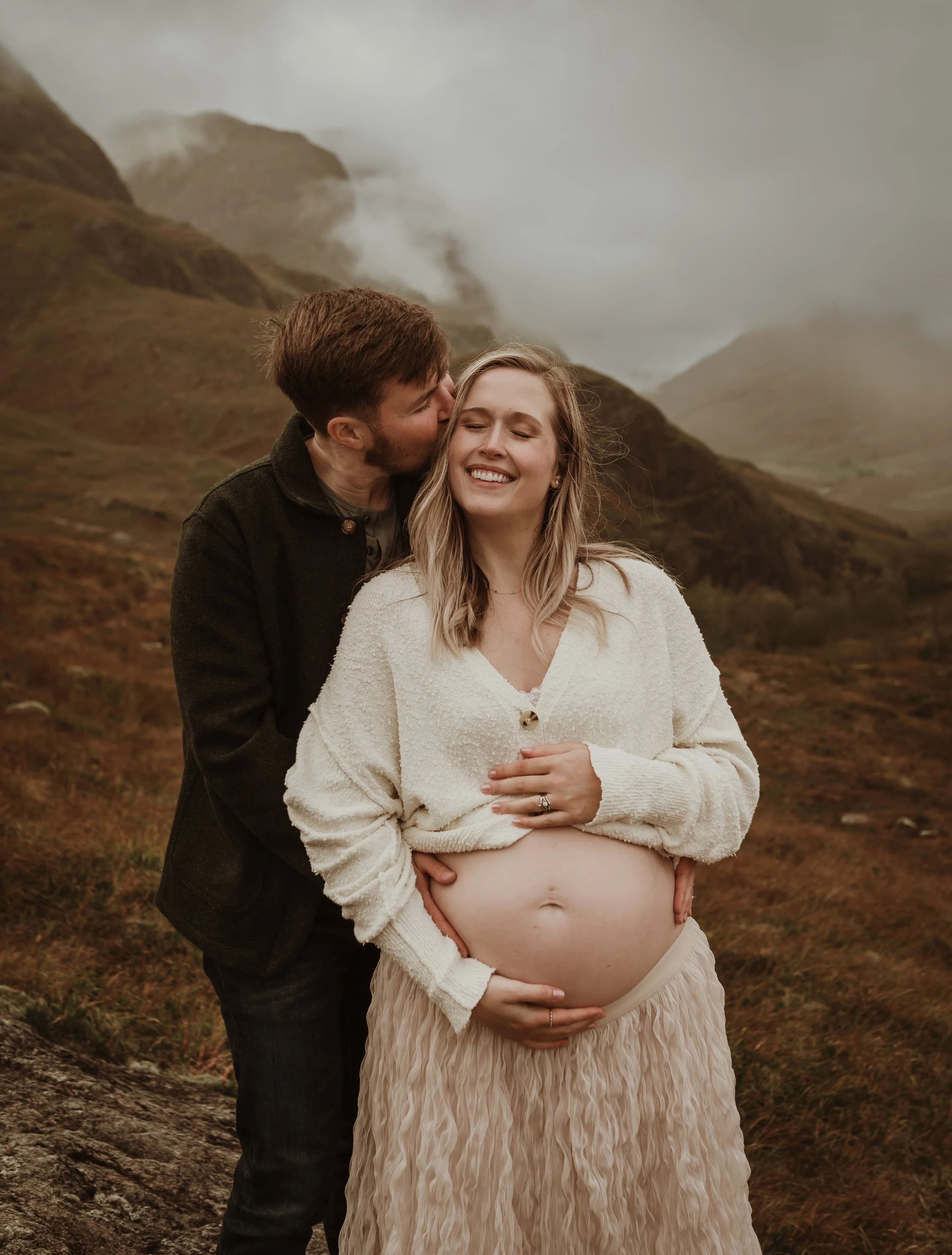 Outdoor maternity photography in Glencoe Scotland with dramatic Highland landscape