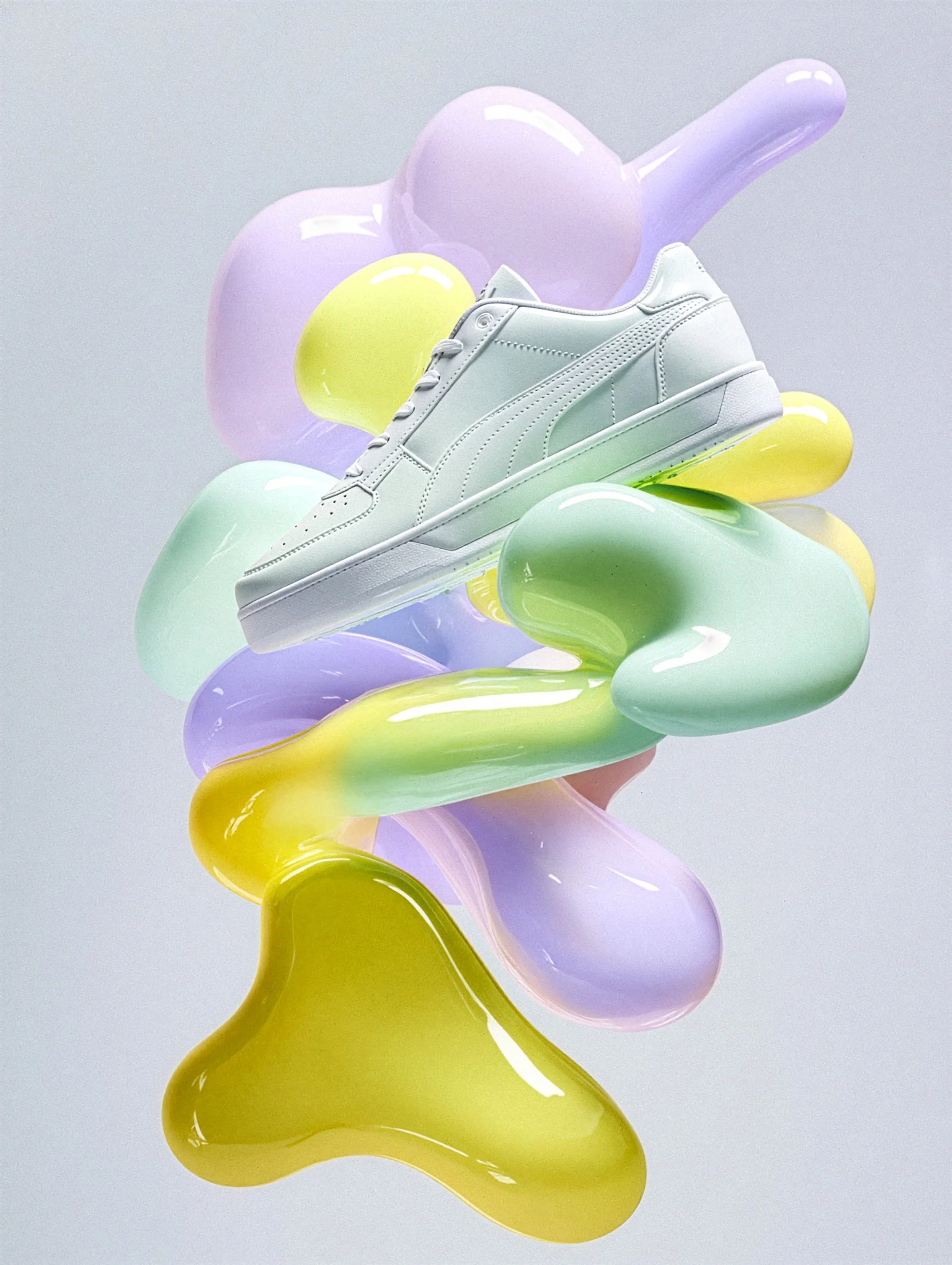 Ein bunter Armbanduhr mit gelbem Zifferblatt und pinken Zeigern, umgeben von bunten, groben, weichen Schwämmen in Pastellfarben vor einem blauen Hintergrund.