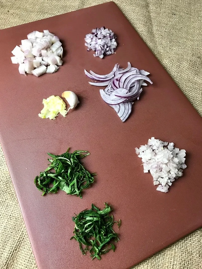 Sliced and diced vegetables on a chopping board