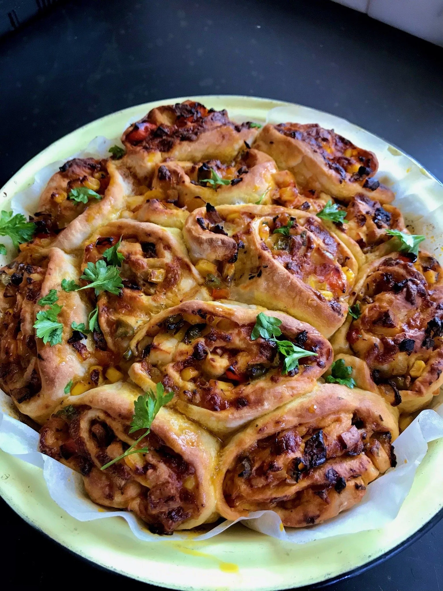 A savory pastry roll with cheese, vegetables, and herbs.