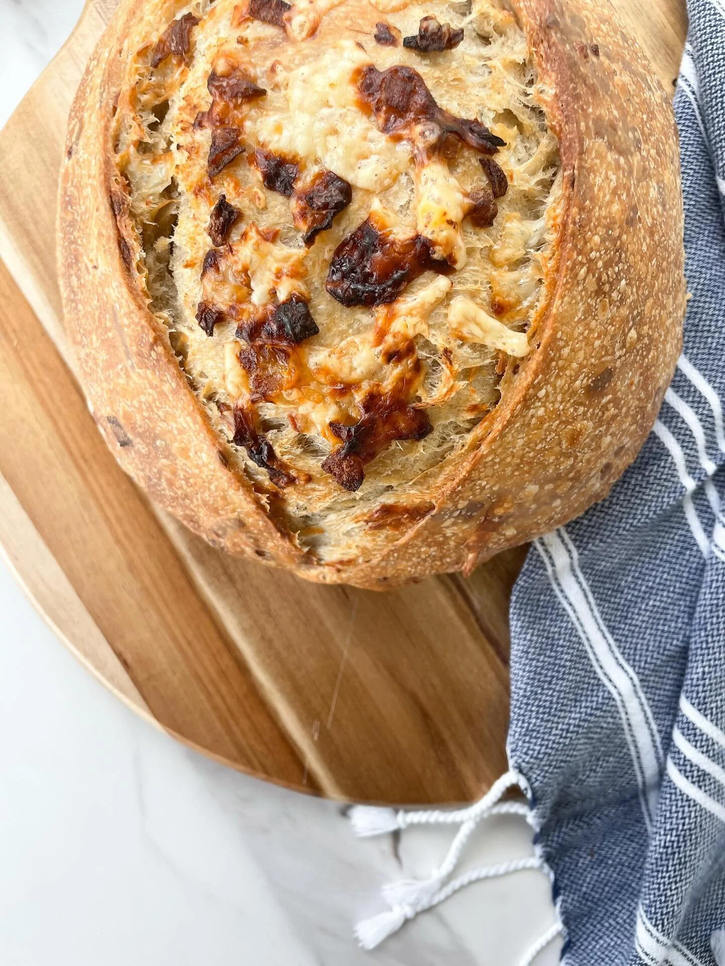 Golden crust. Melty gouda. Sweet, slow-cooked onions in every bite.
This loaf is comfort food at its finest.

Our Caramelized Onion &amp; Gouda Sourdough is loaded with layers of flavor - caramelized onions, layered with spices, and the perfect amoun