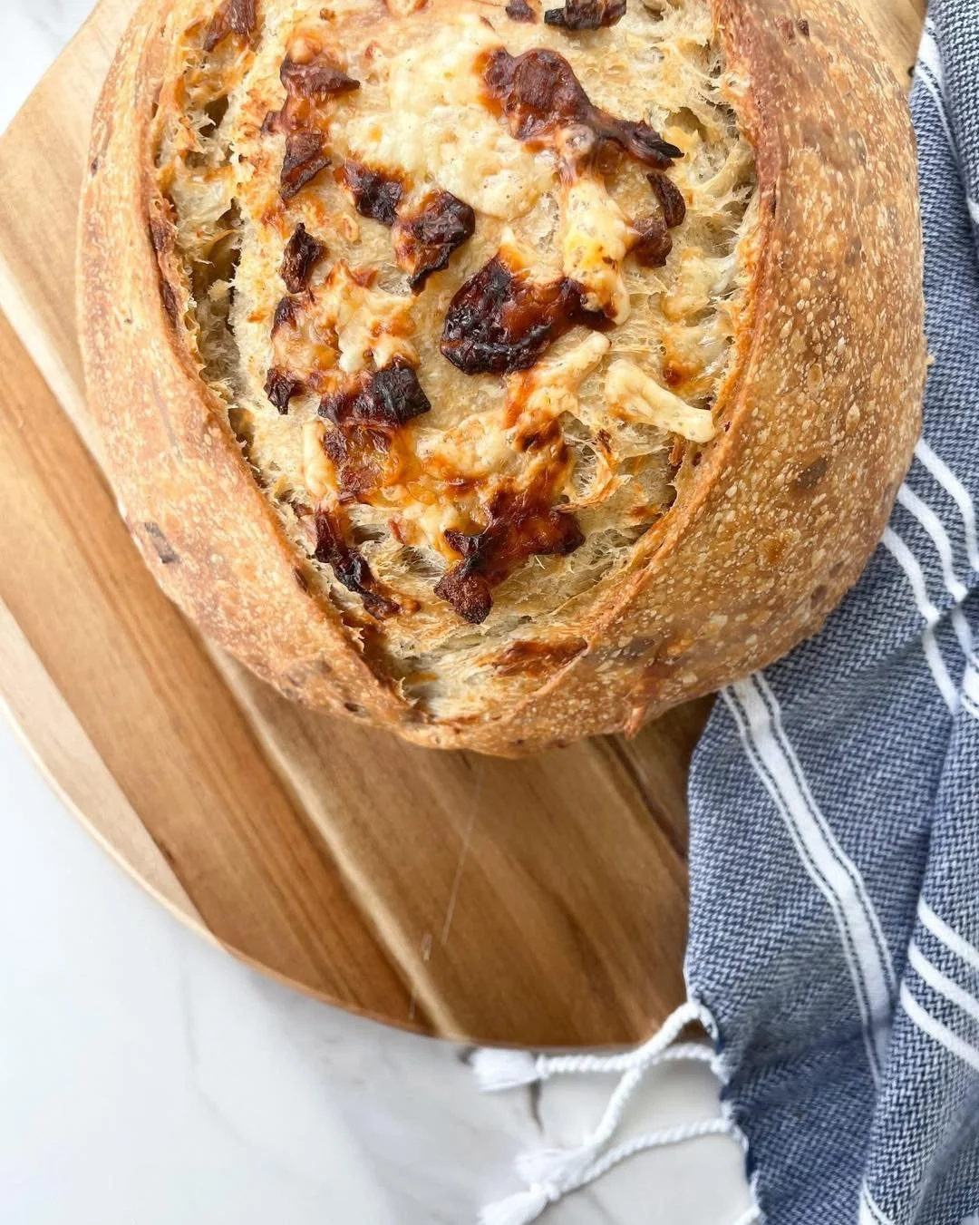 Caramelized Onion &amp; Gouda

Made with real onions, caramelized low and slow until deeply golden and naturally sweet. That sweetness meets savory, hand shredded Gouda, melting into rich, creamy pockets throughout. Garlic, thyme, and cracked pepper 